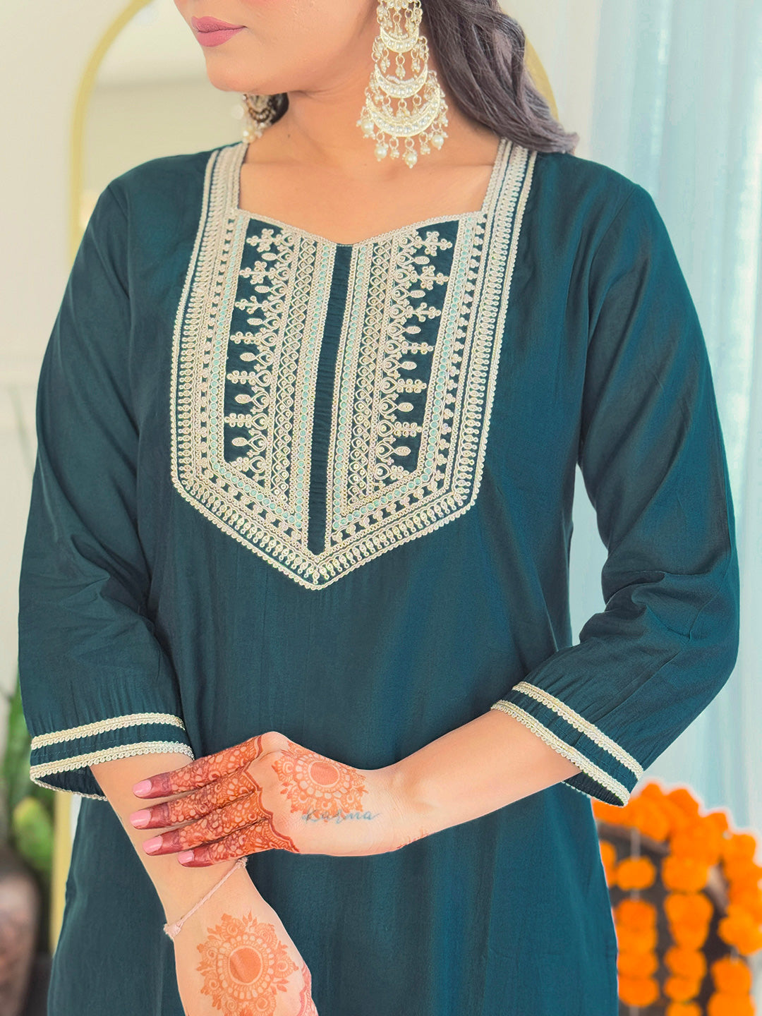 Close-up of the teal kurti's embroidered square neckline and sleeve detailing, showing the quality of the BSY viscose fabric.
