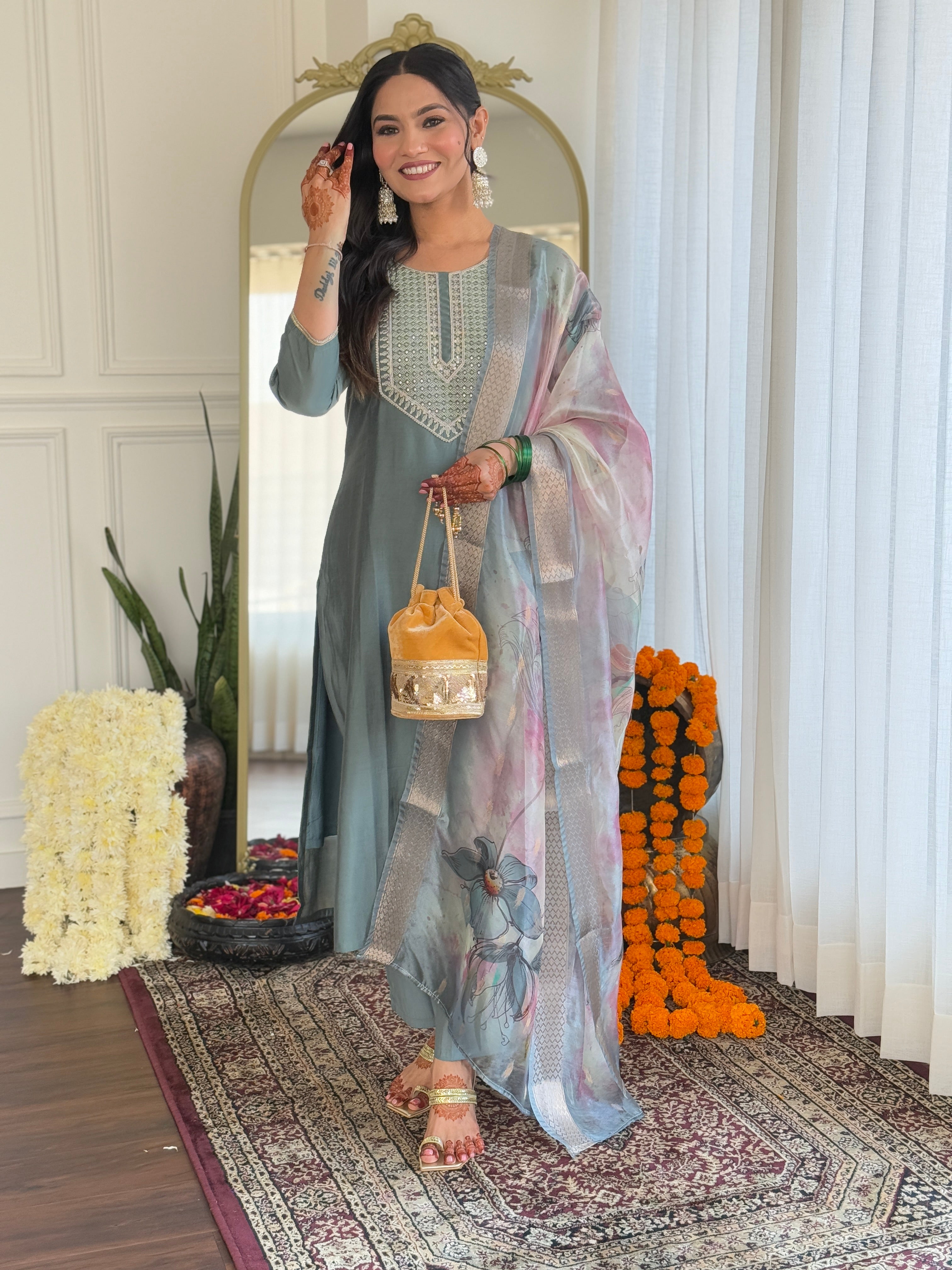Pista green BSY Viscose kurti set with intricate embroidery, modeled by a smiling woman with a floral organza dupatta and traditional accessories.
