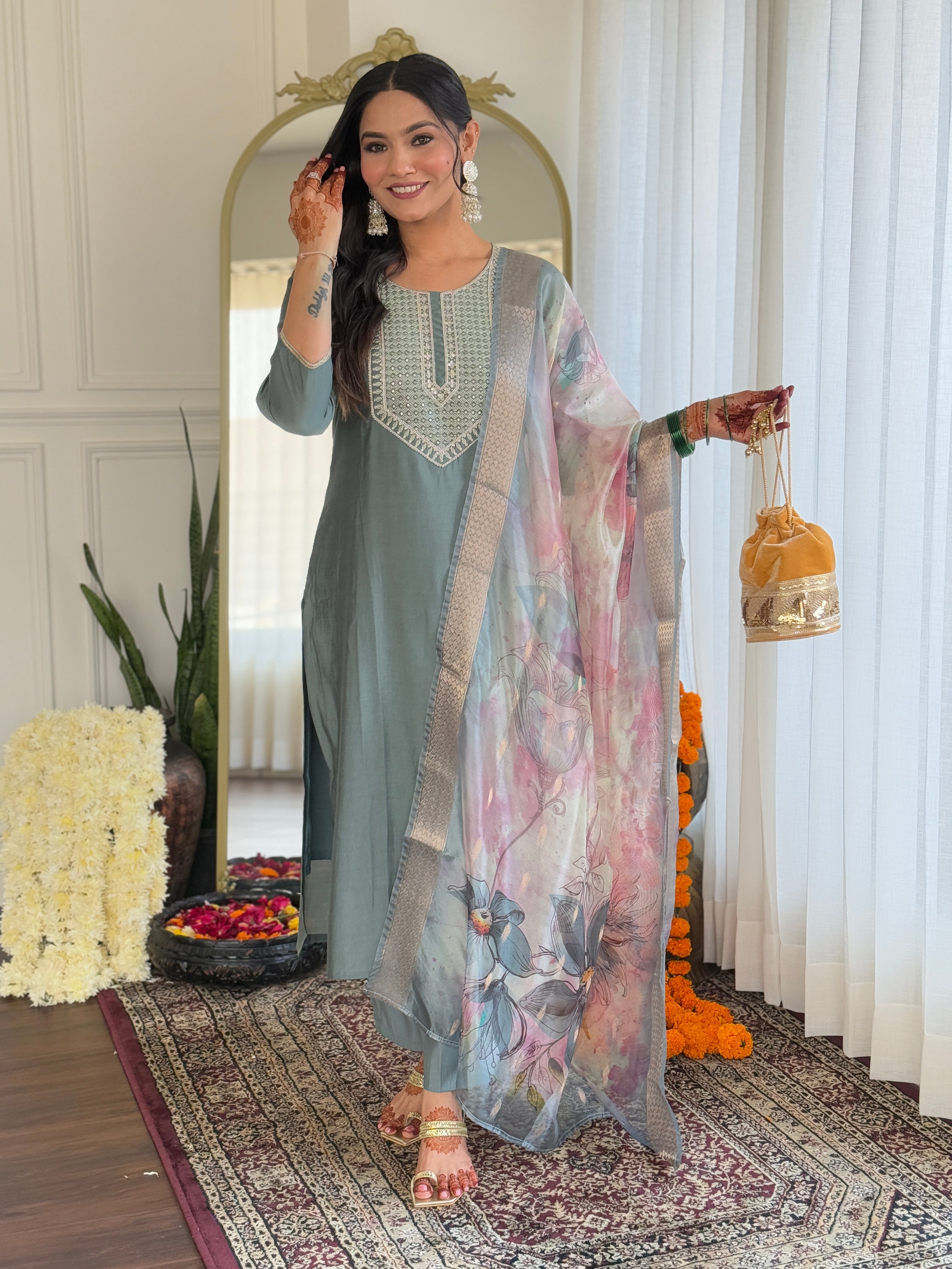 Close-up of the woman in the Pista green kurti set, emphasizing the detailed embroidery on the neckline and the subtle floral print on the dupatta.