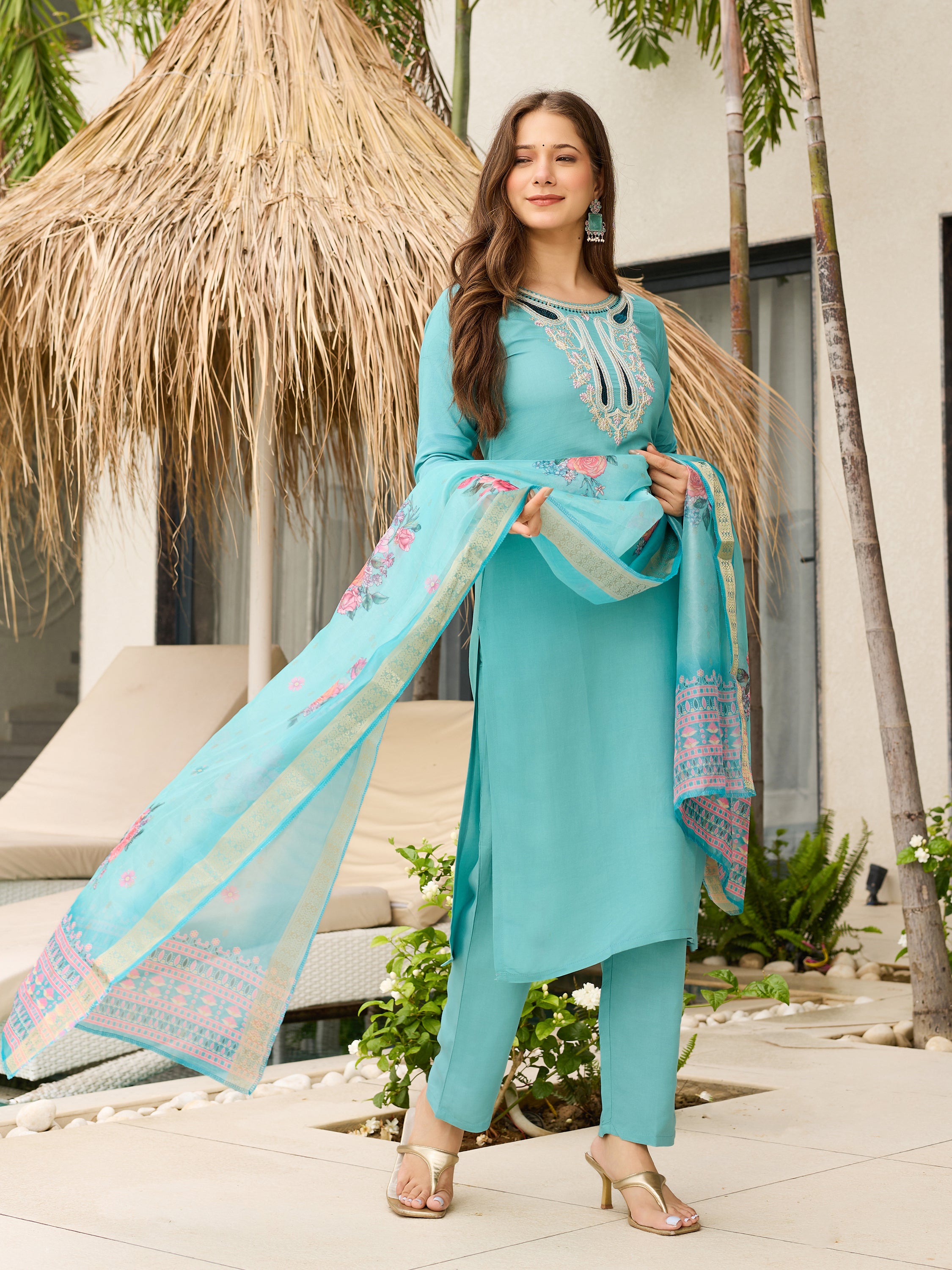 Model showcasing the elegant drape of the teal blue kurti and organza dupatta, smiling confidently.