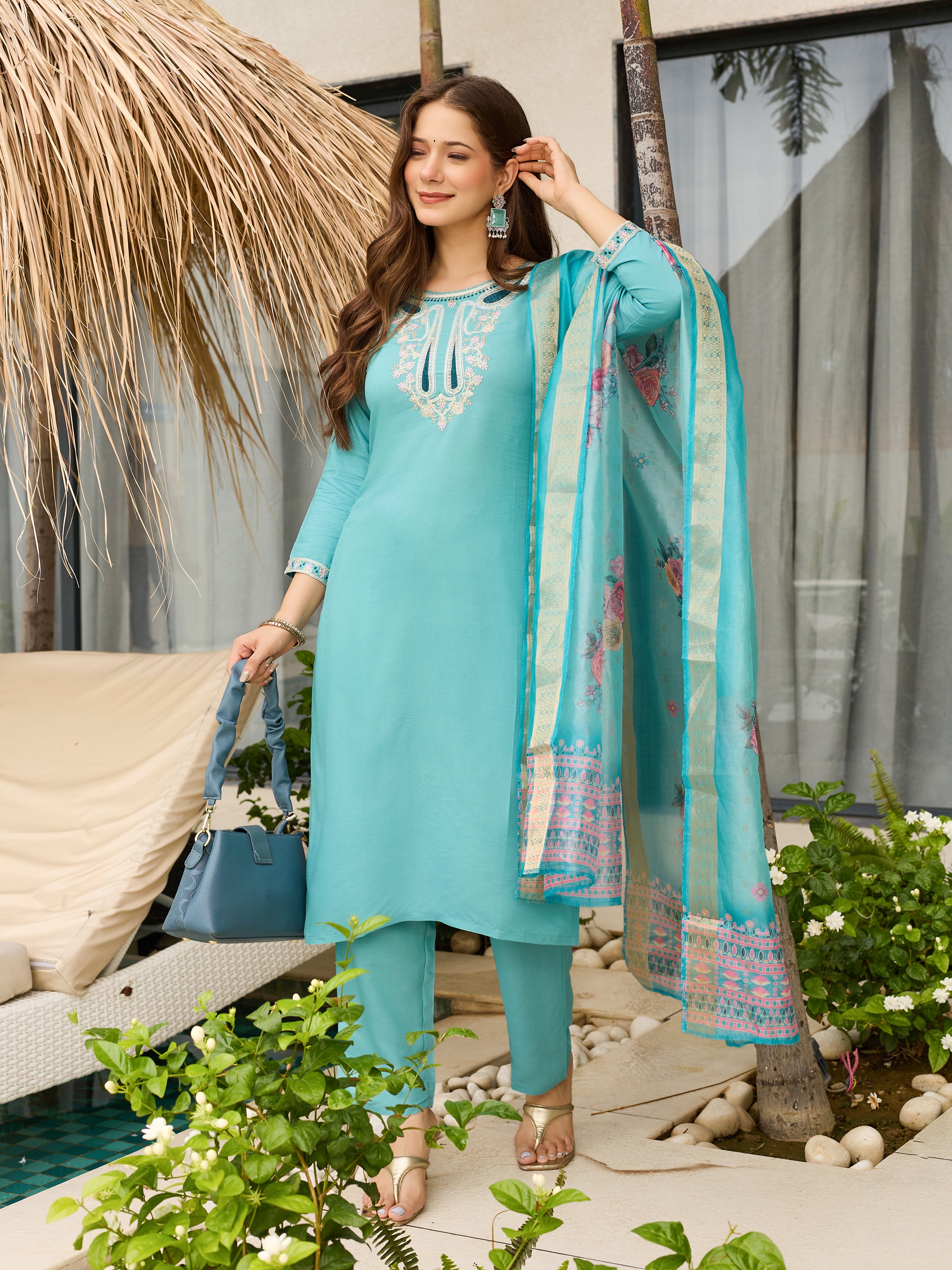 TRENDBUY D678 Sky Blue Kurti Set, woman holding matching blue purse, outdoor fashion shoot