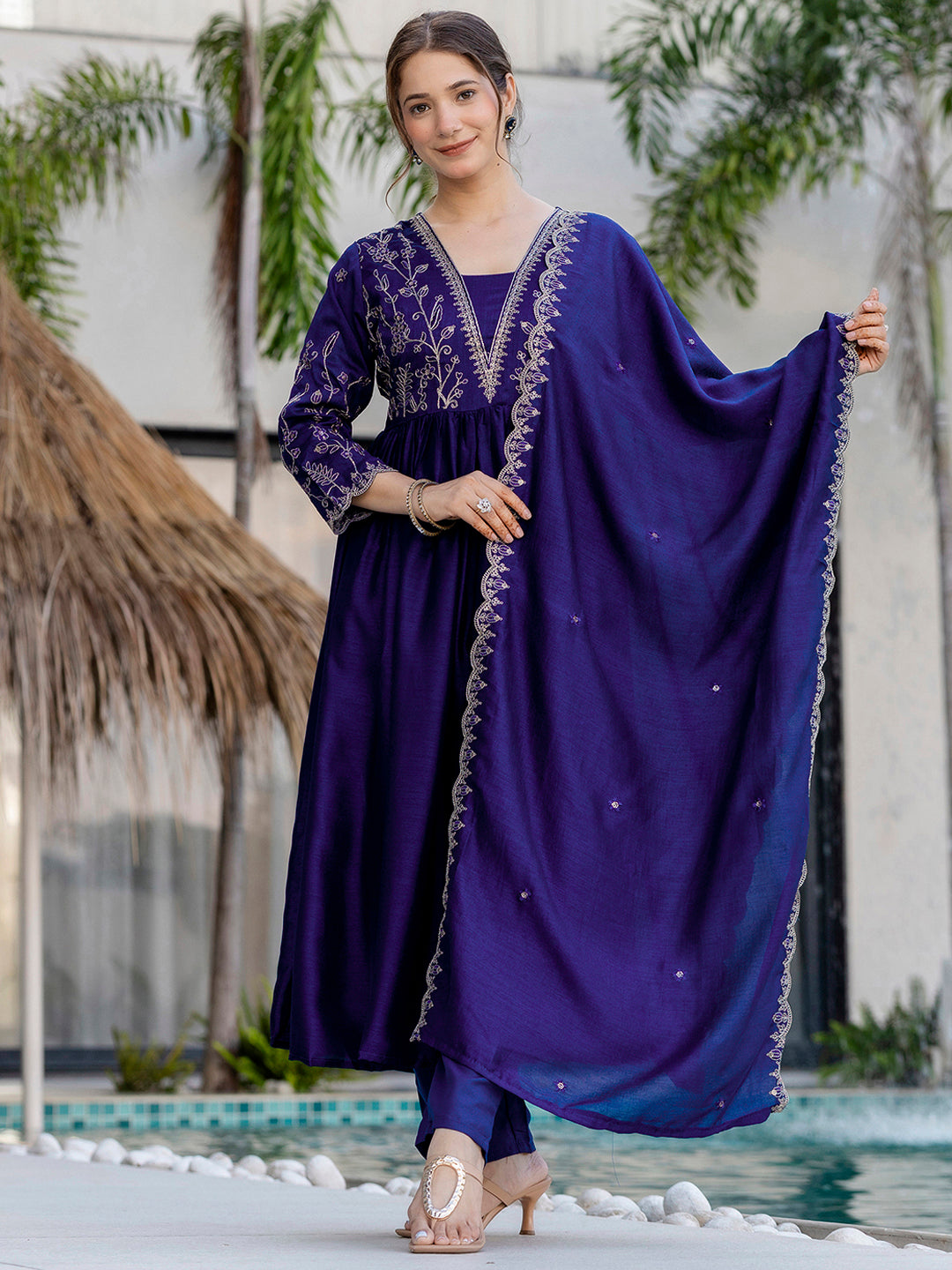 TRENDBUY model in elegant blue Vichitra silk kurta set with intricate embroidery and matching dupatta by a pool
