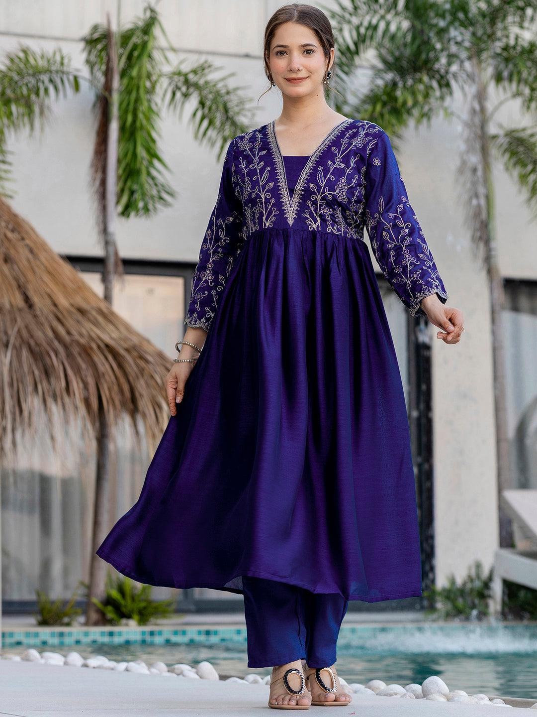 Model in flowy blue embroidered kurta set, demonstrating the comfortable fit and elegant drape of the outfit
