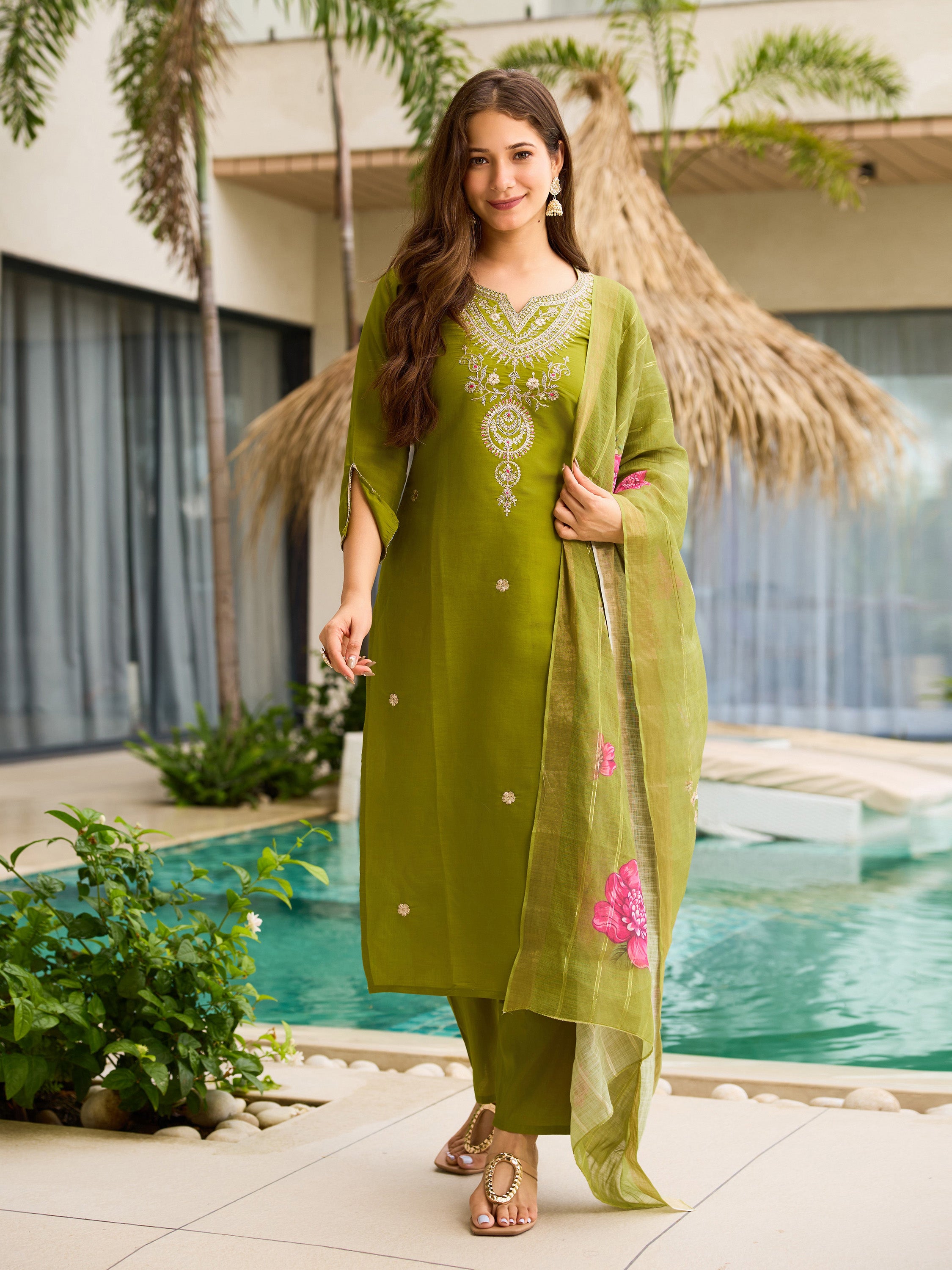 TRENDBUY model showcasing a lime green embroidered viscose kurti set with floral jacquard dupatta, by a pool