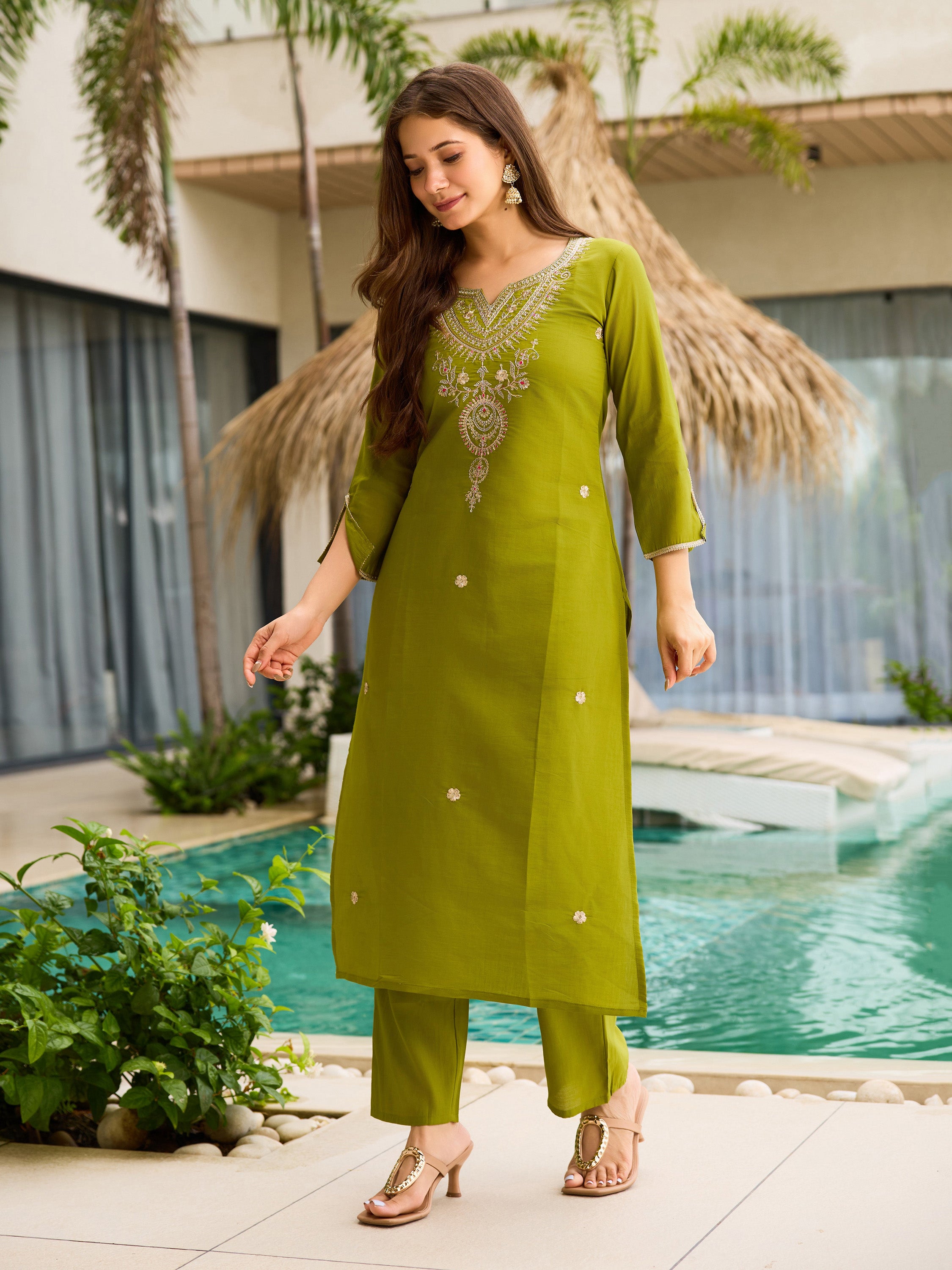 Full length view of a woman wearing TRENDBUY lime green kurti and pant set, showing the subtle embroidery