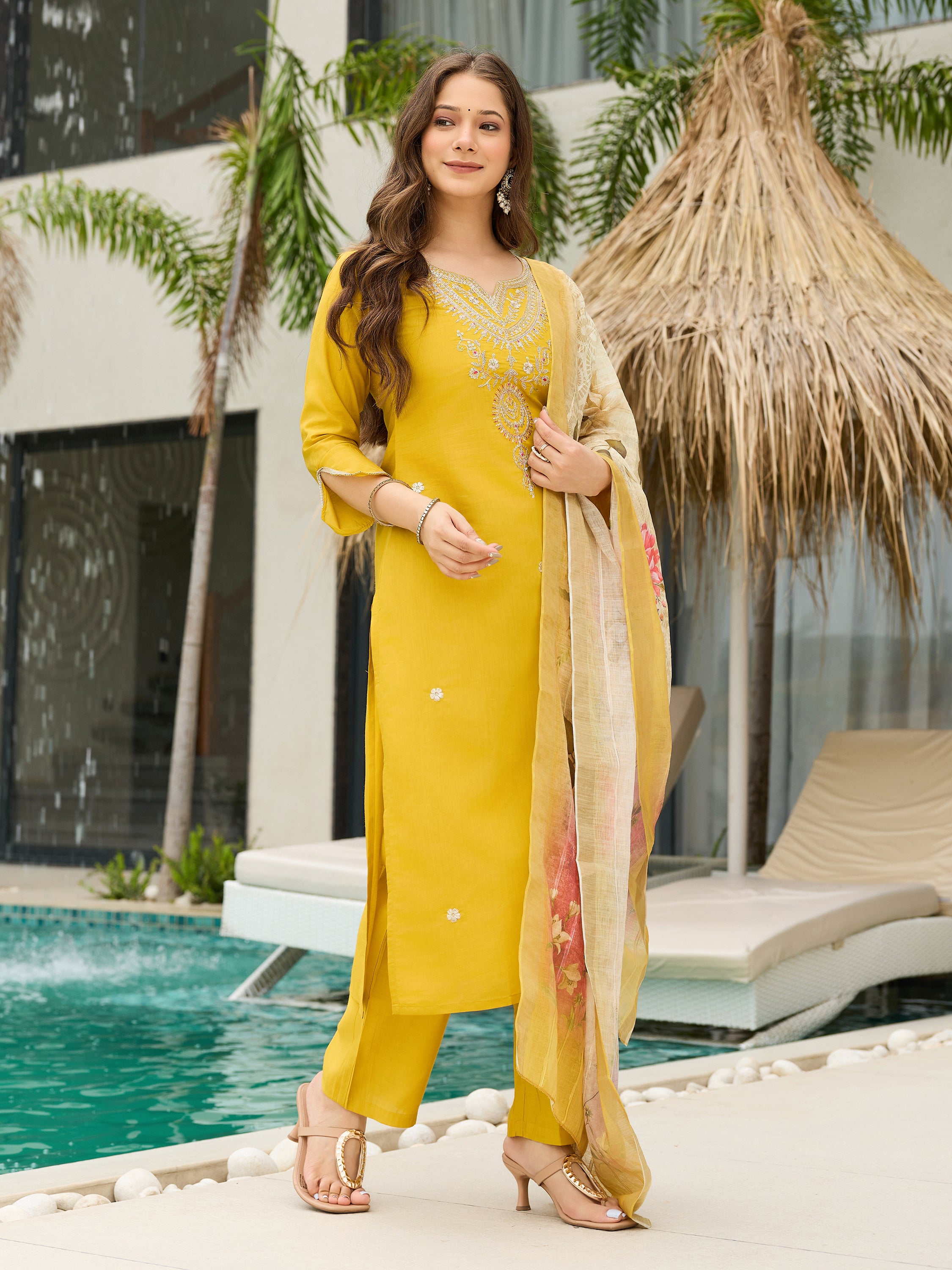 Smiling woman in full shot wearing TRENDBUY mustard yellow kurti and pant set, showcasing ethnic elegance