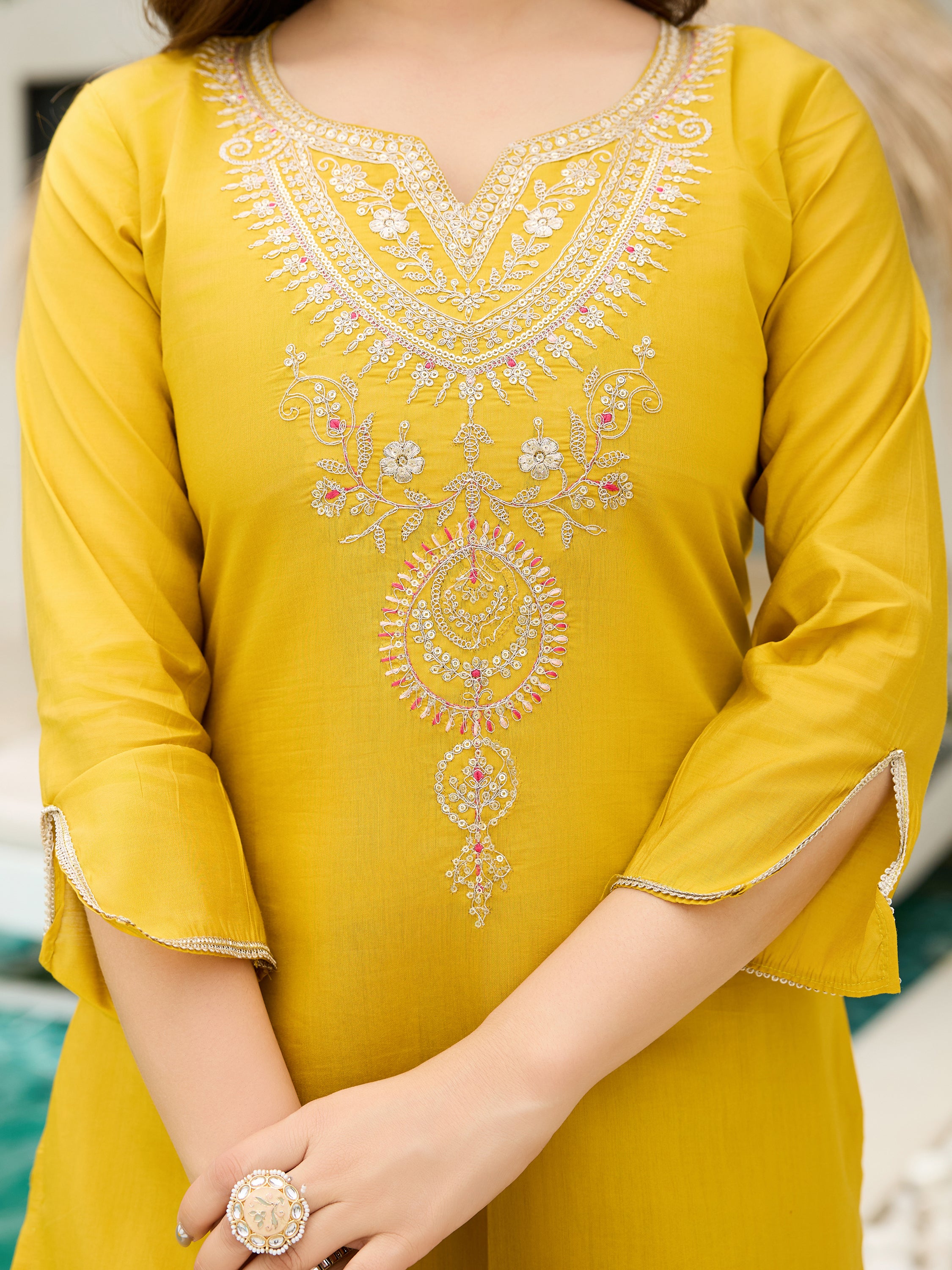 Detailed close-up of the delicate white and pink embroidery on the V-neckline of the TRENDBUY mustard kurti