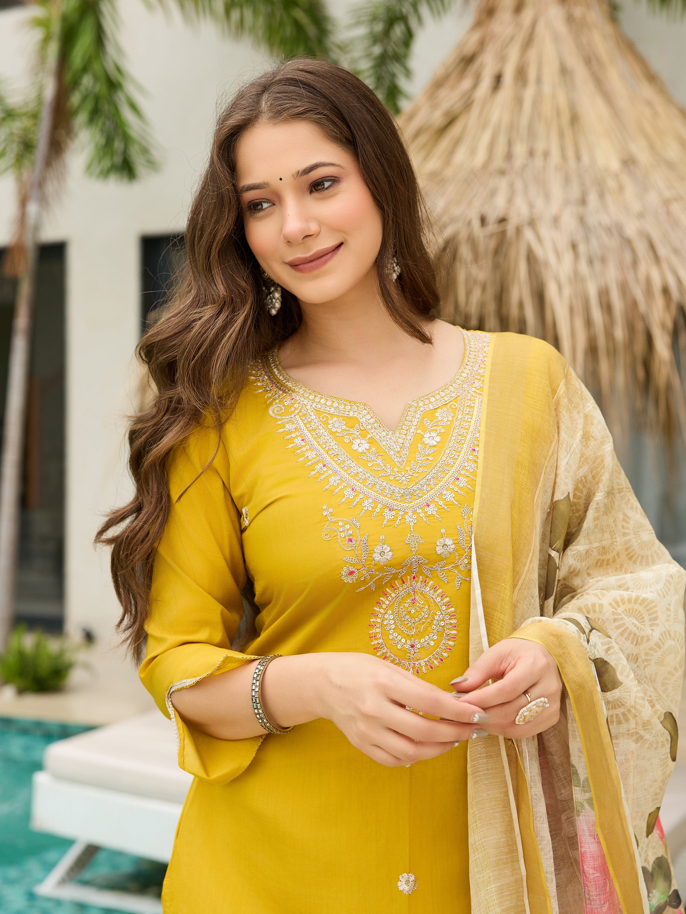 TRENDBUY model in a cheerful mustard yellow kurti set, a close-up showing her smiling expression and the dupatta