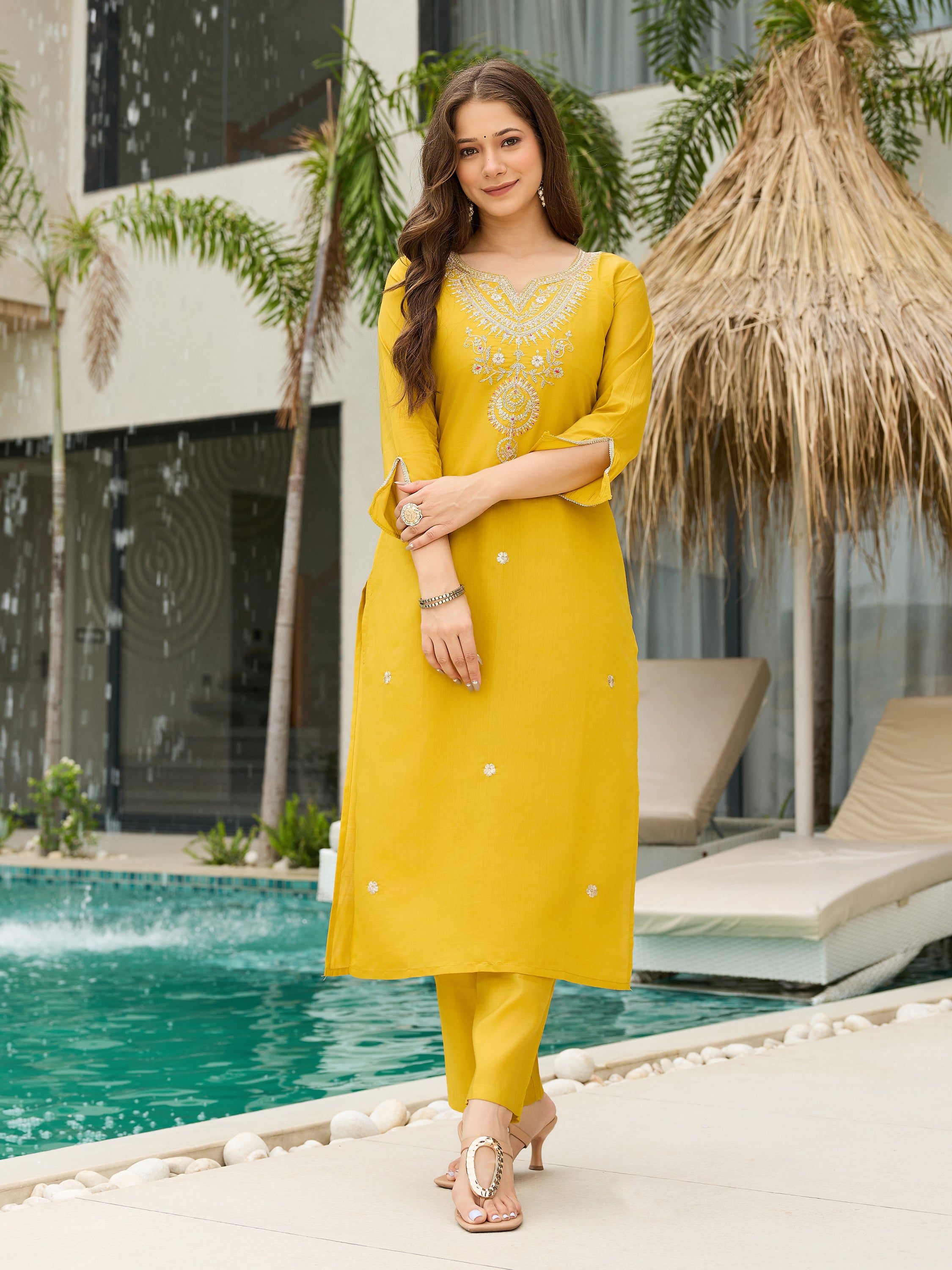 Front pose of TRENDBUY model in mustard yellow kurti and pant set, without dupatta, highlighting the simple yet elegant cut
