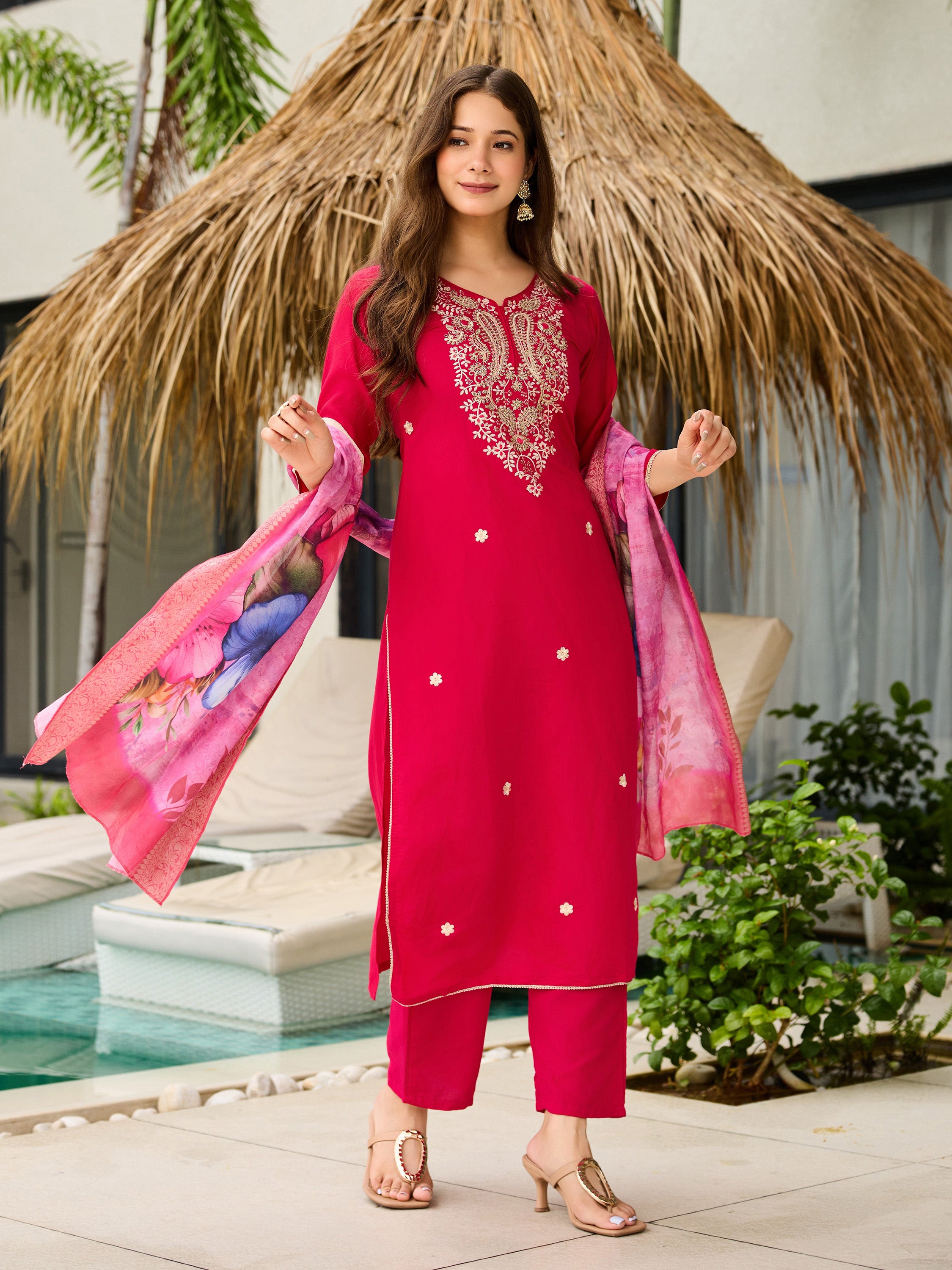 Dynamic pose of TRENDBUY model with the pink embroidered kurti set and vibrant jacquard dupatta.
