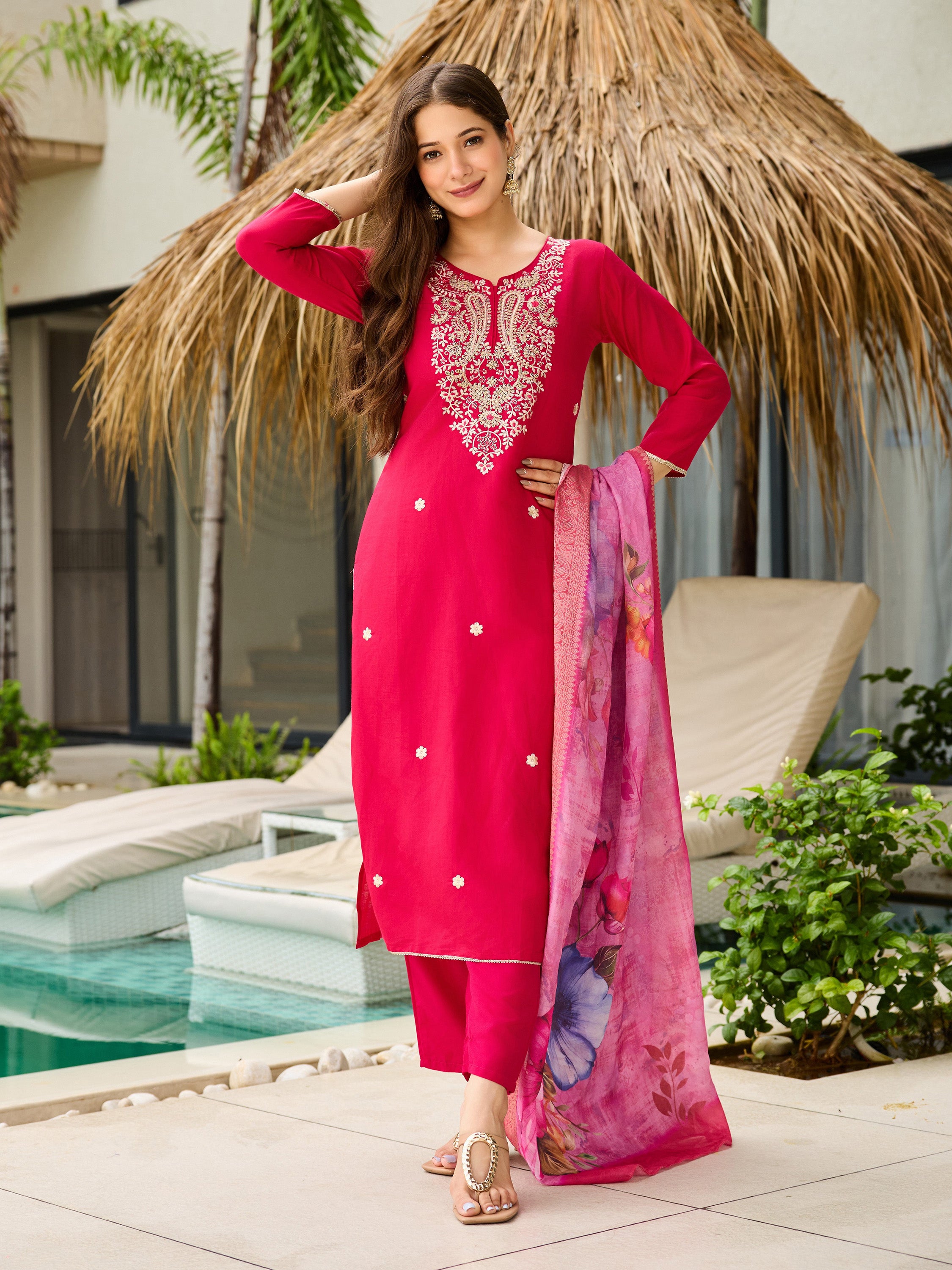 TRENDBUY model posing gracefully in the pink viscose kurti set, hand in hair.