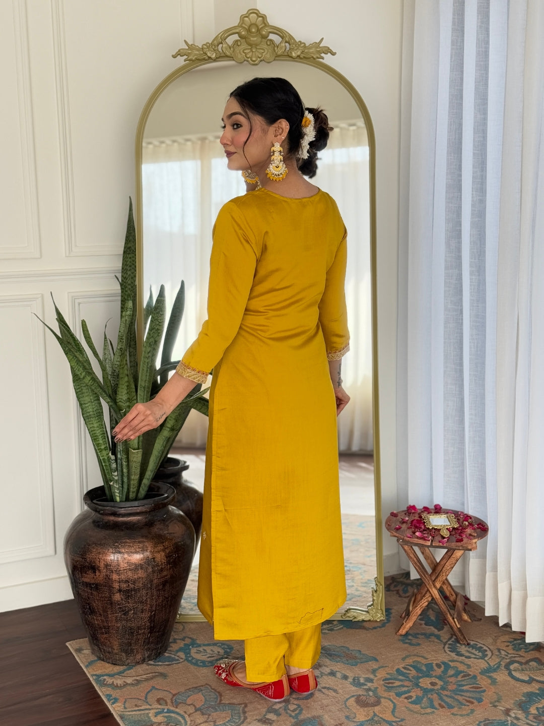 Back view of the mustard rayon kurti and pant set, highlighting subtle sleeve and hem details