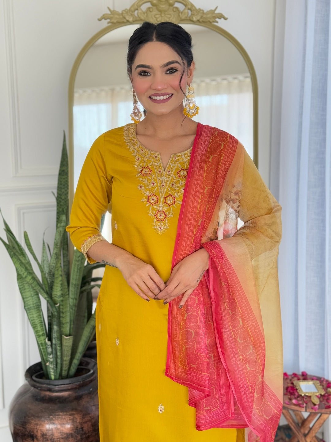 Full-length shot of a graceful model in the mustard rayon kurti set, showcasing the flow and design of the outfit indoors