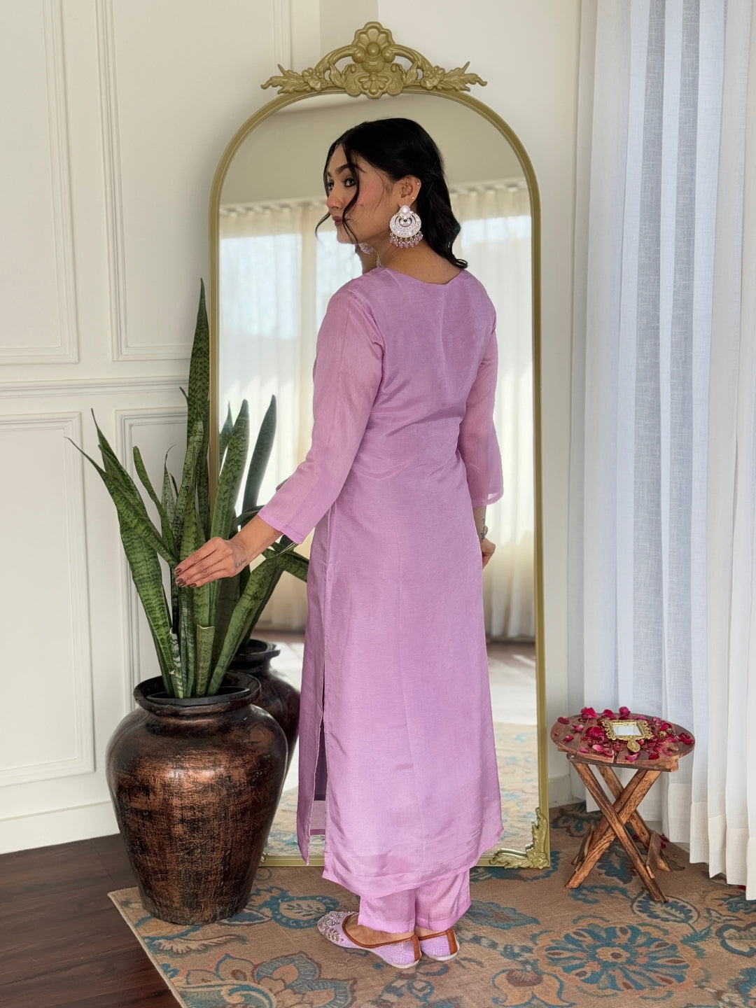 Back view of the model in the elegant lavender rayon kurti and pant set.