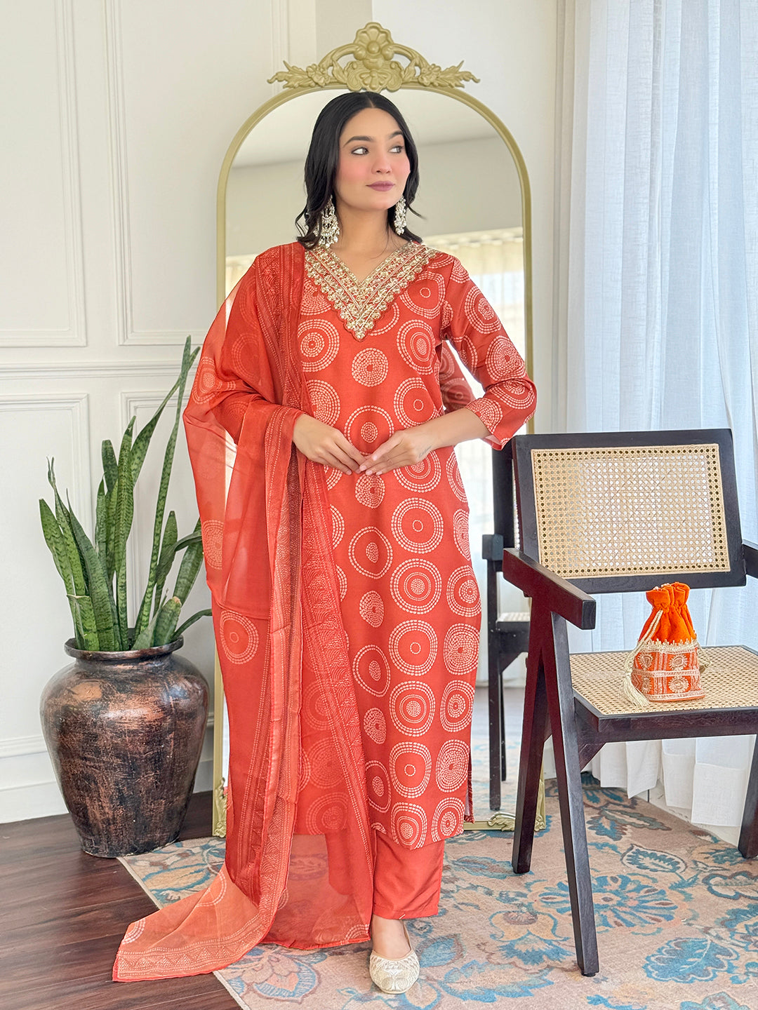 TRENDBUY model in full length wearing the D732 orange rayon kurta set, with the dupatta draped over one shoulder.