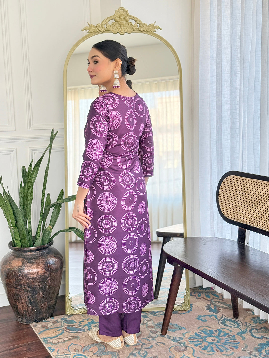 Back view of TRENDBUY model in D732 purple rayon kurti set, showcasing the repeating circular pattern and straight fit.