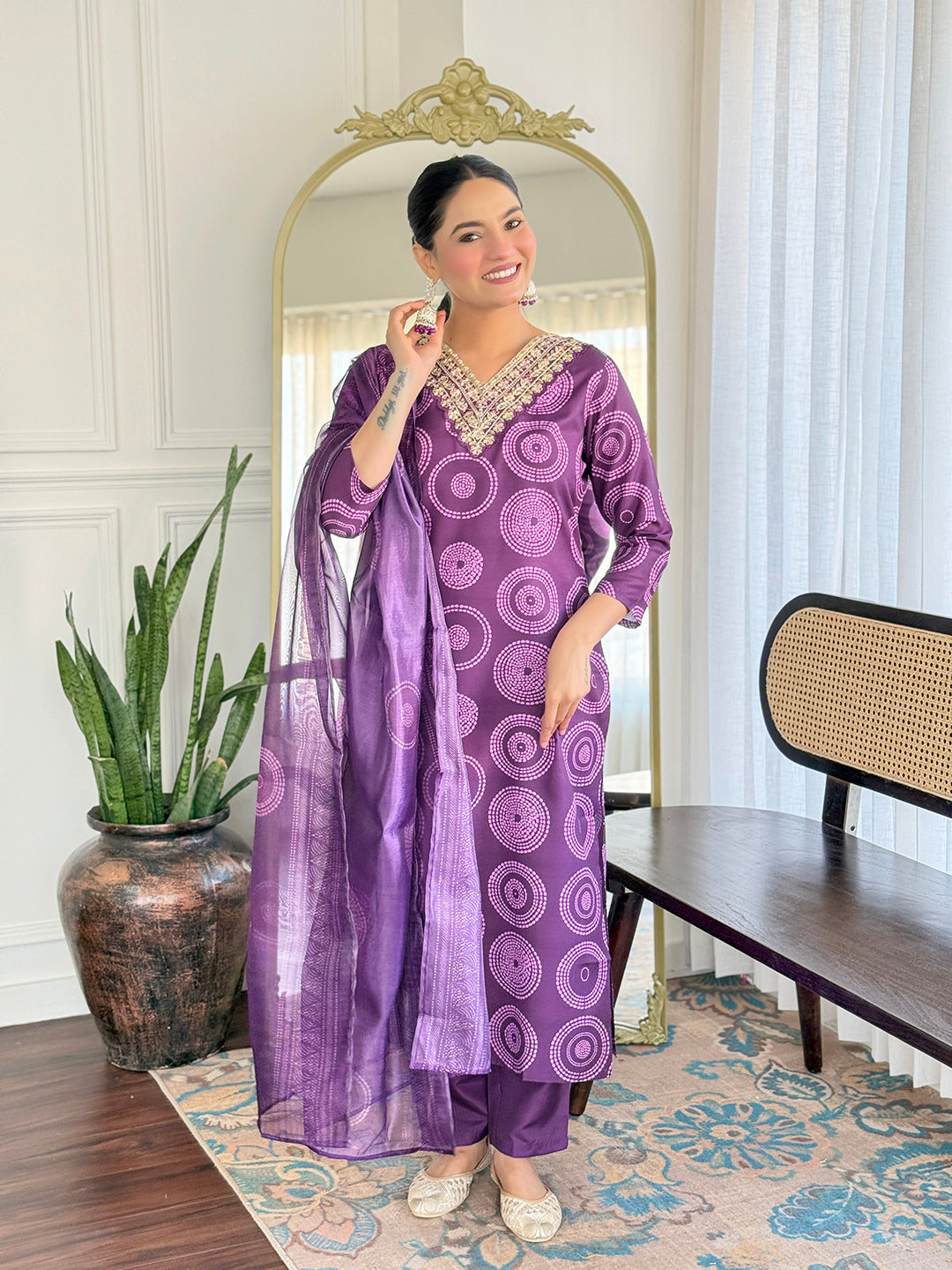 Smiling TRENDBUY model in D732 purple geometric print kurti set, looking at the camera, highlighting the outfit's appeal.