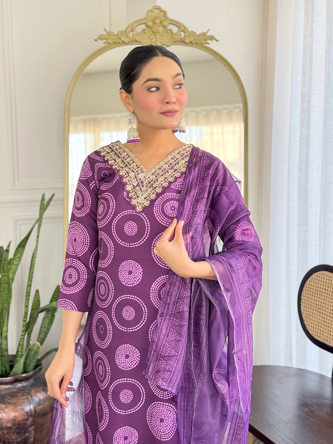 TRENDBUY model looking away, posing in the D732 purple kurti set, showing the details of the embroidered neckline and dupatta.
