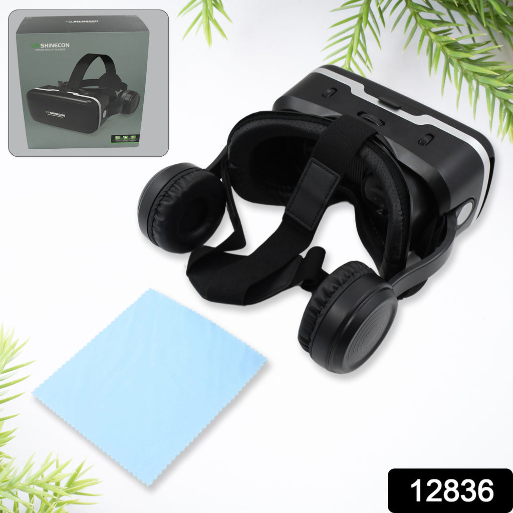 Man wearing black 3D HD VR headset with integrated headphones, holding smartphone for VR movies & games.