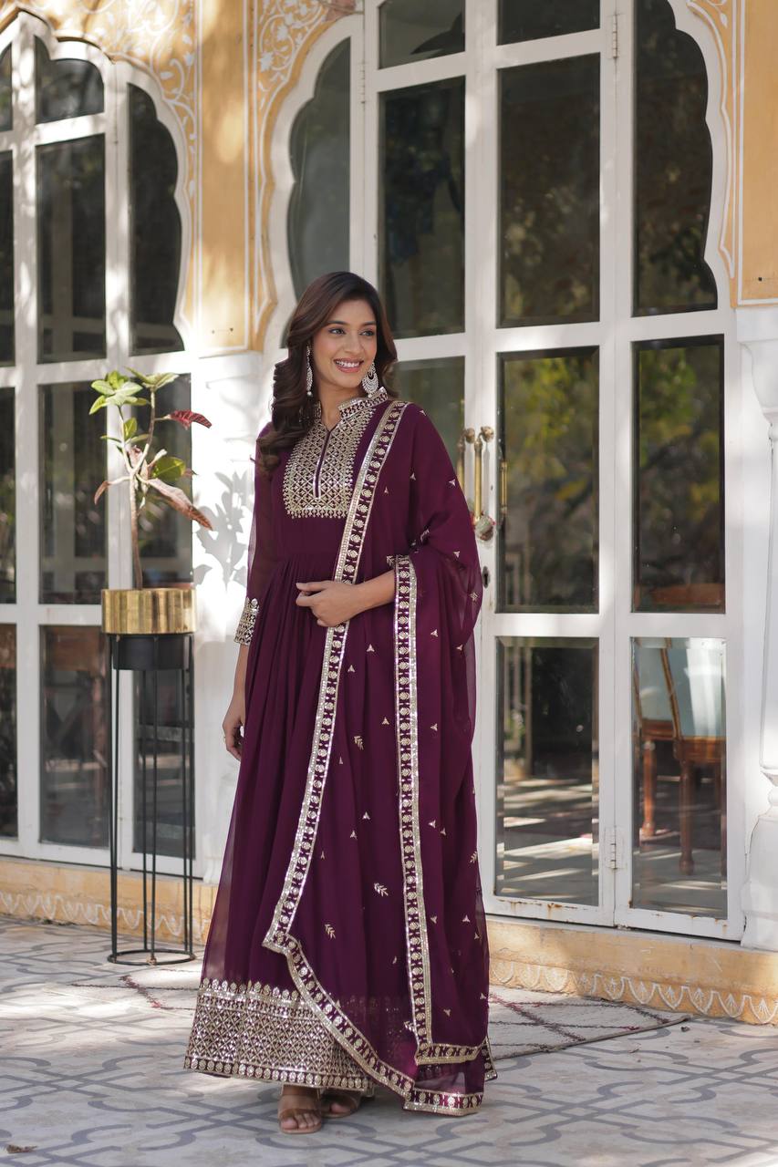 Model showcasing new wine Anarkali gown, matching pant, and dupatta set, elegant full length view.