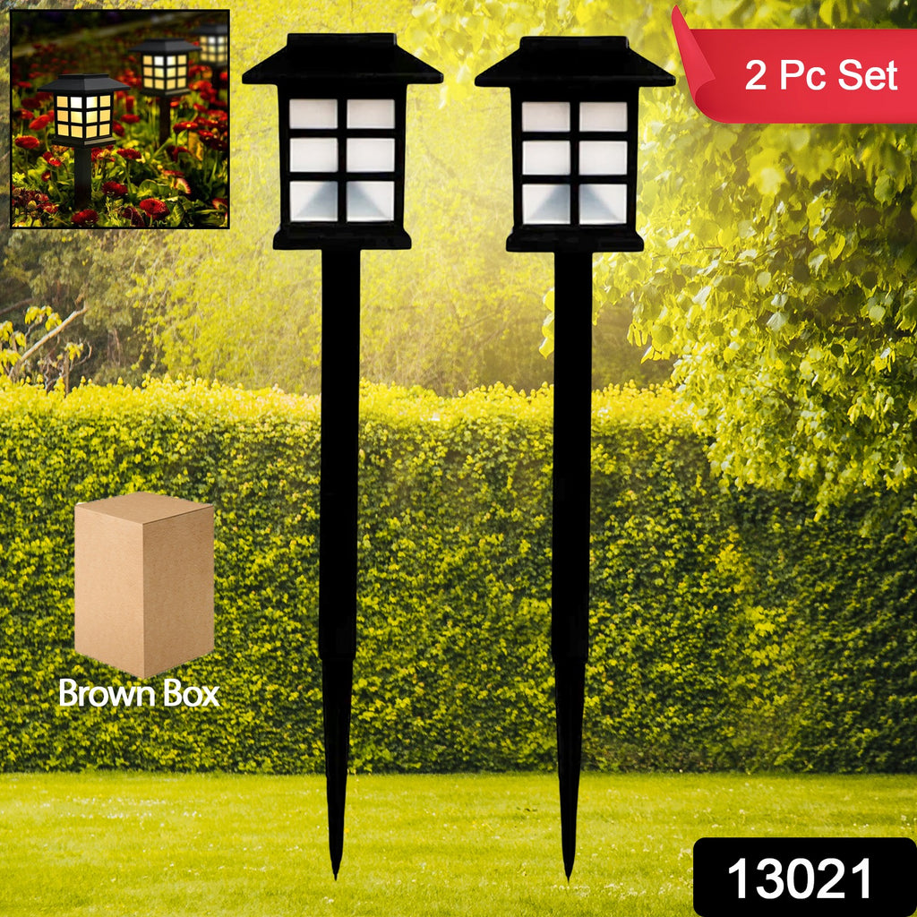 Waterproof solar landscape lights brightening an outdoor walkway at dusk, ideal for garden and yard.
