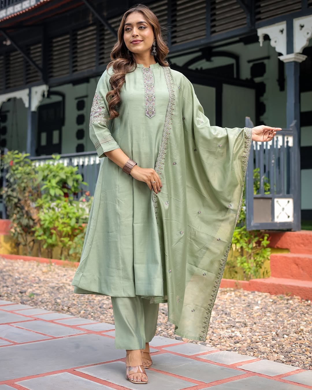 Full shot of a woman confidently posing in the TRENDBUY Olive Green Embroidered Kurta Set, showcasing the flow of the kurta and dupatta.
