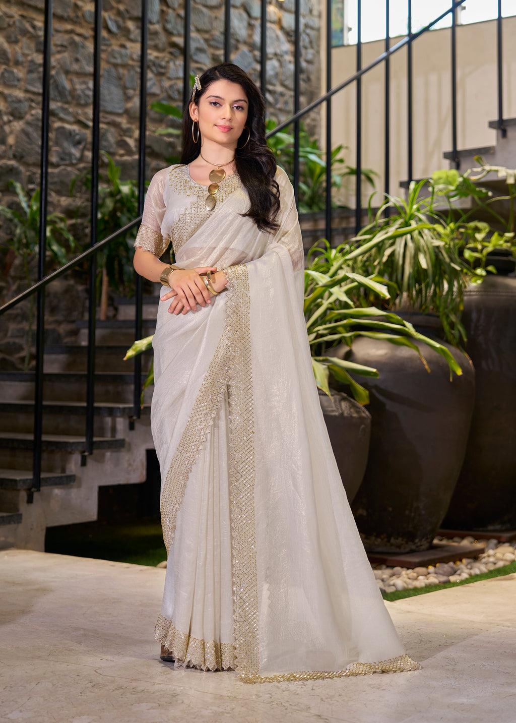 Elegant off-white saree with traditional designs, perfect for festival wear.