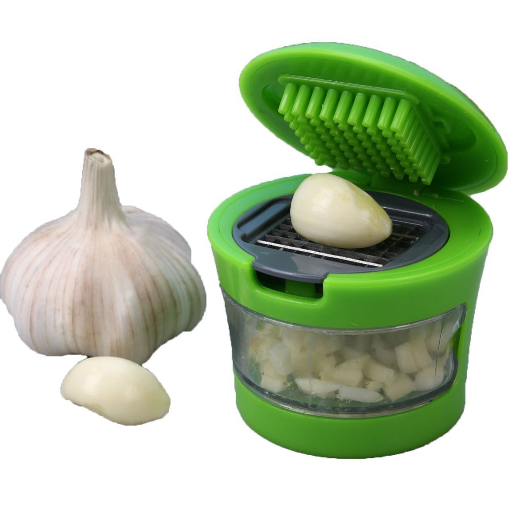 Handheld ginger garlic crusher for quick and easy kitchen food preparation