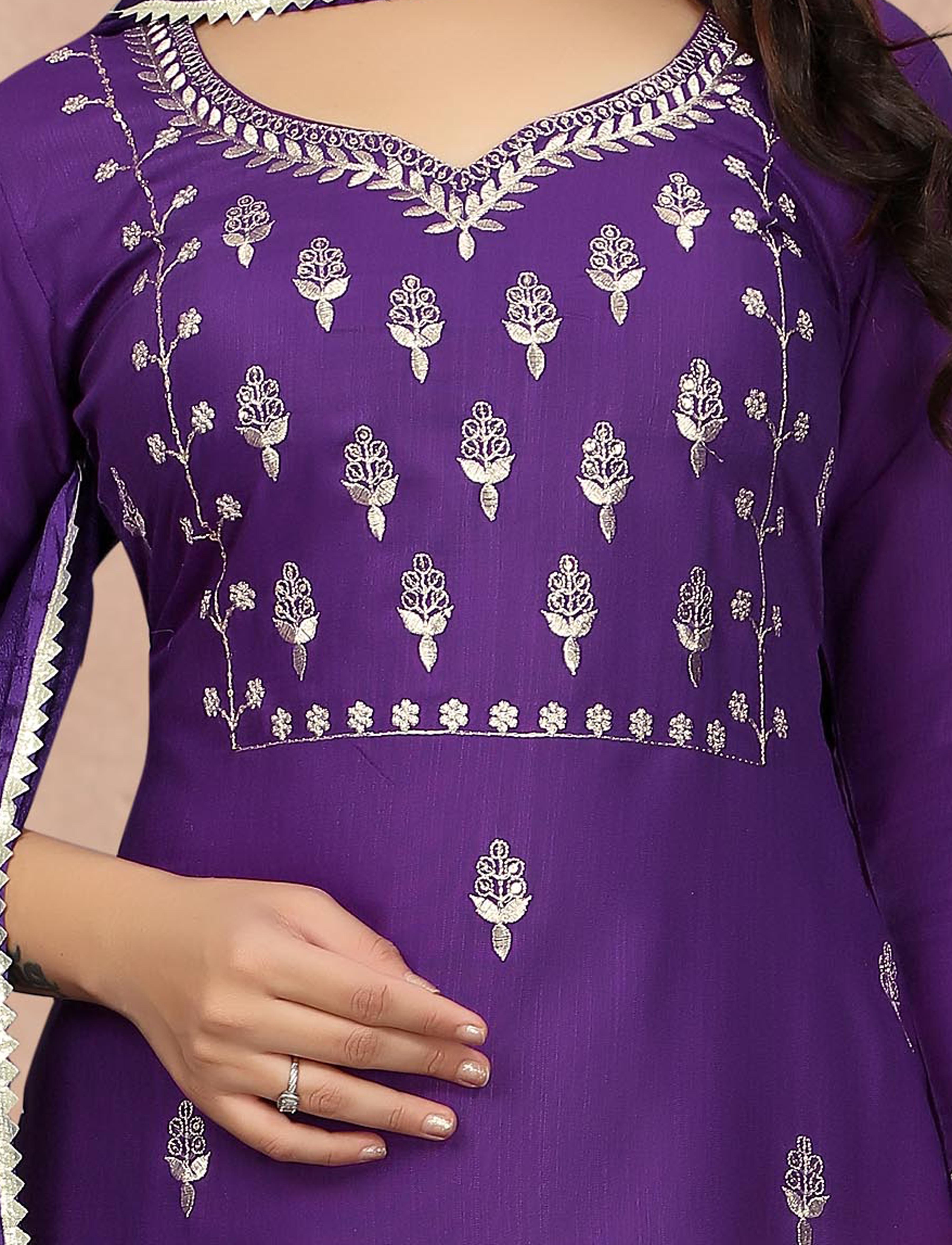 Detailed shot of the delicate silver embroidery and neckline design on the purple kurti.