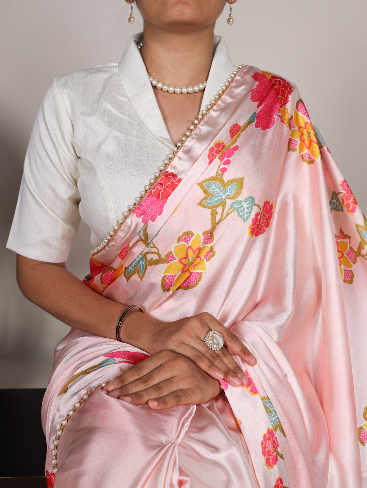 Peach Japan satin silk saree with digital floral print & elegant pearl lace border