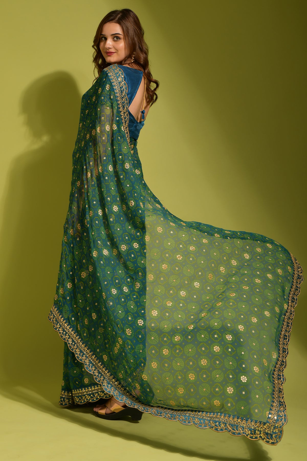 Exquisite petrol Georgette Chiffon Saree with flower print, foil & sequin work.