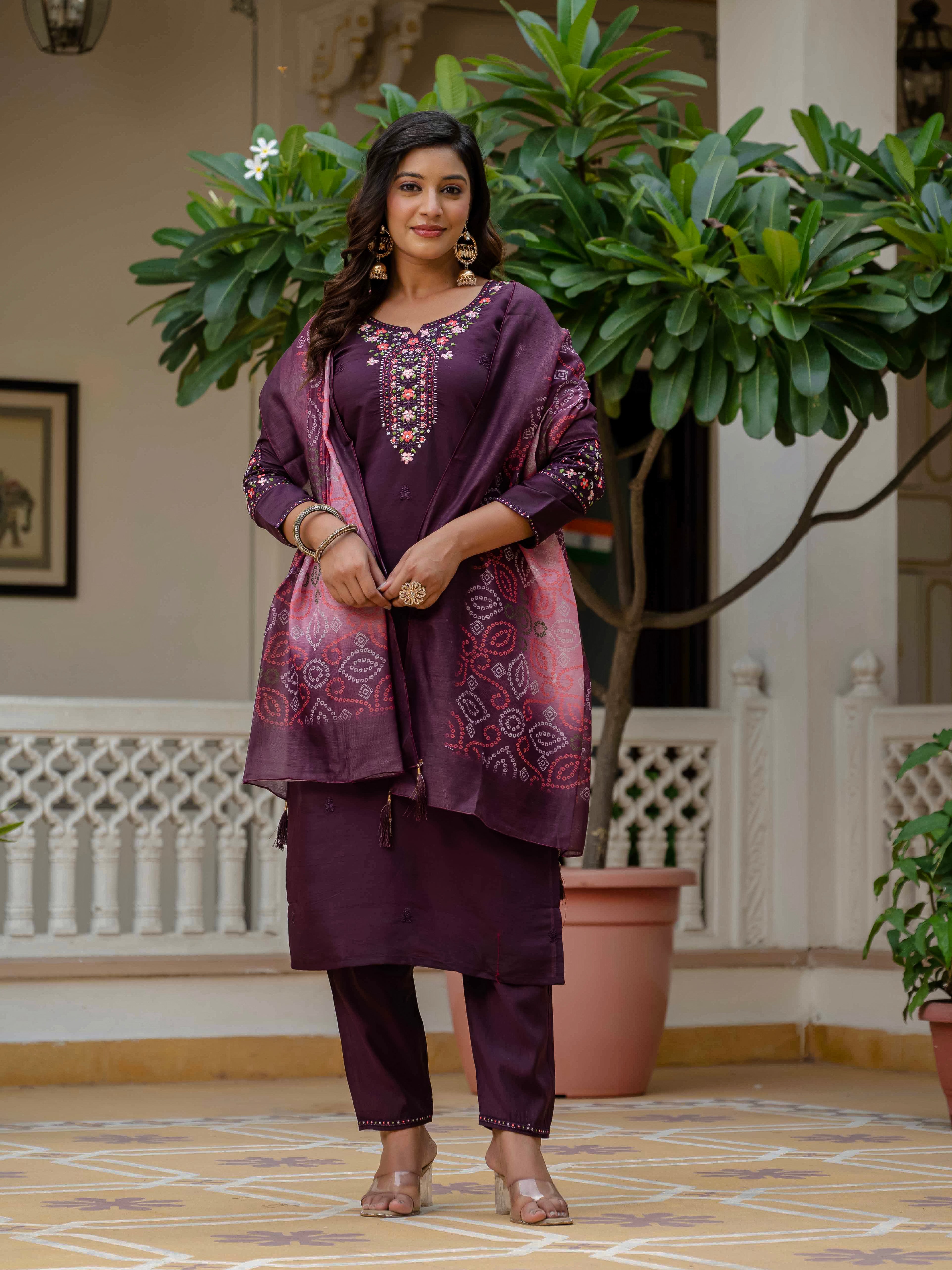 Full length shot of a cheerful model posing in the TRENDBUY WF-NYSA plum kurti, pant, and beautiful bandhani print dupatta.