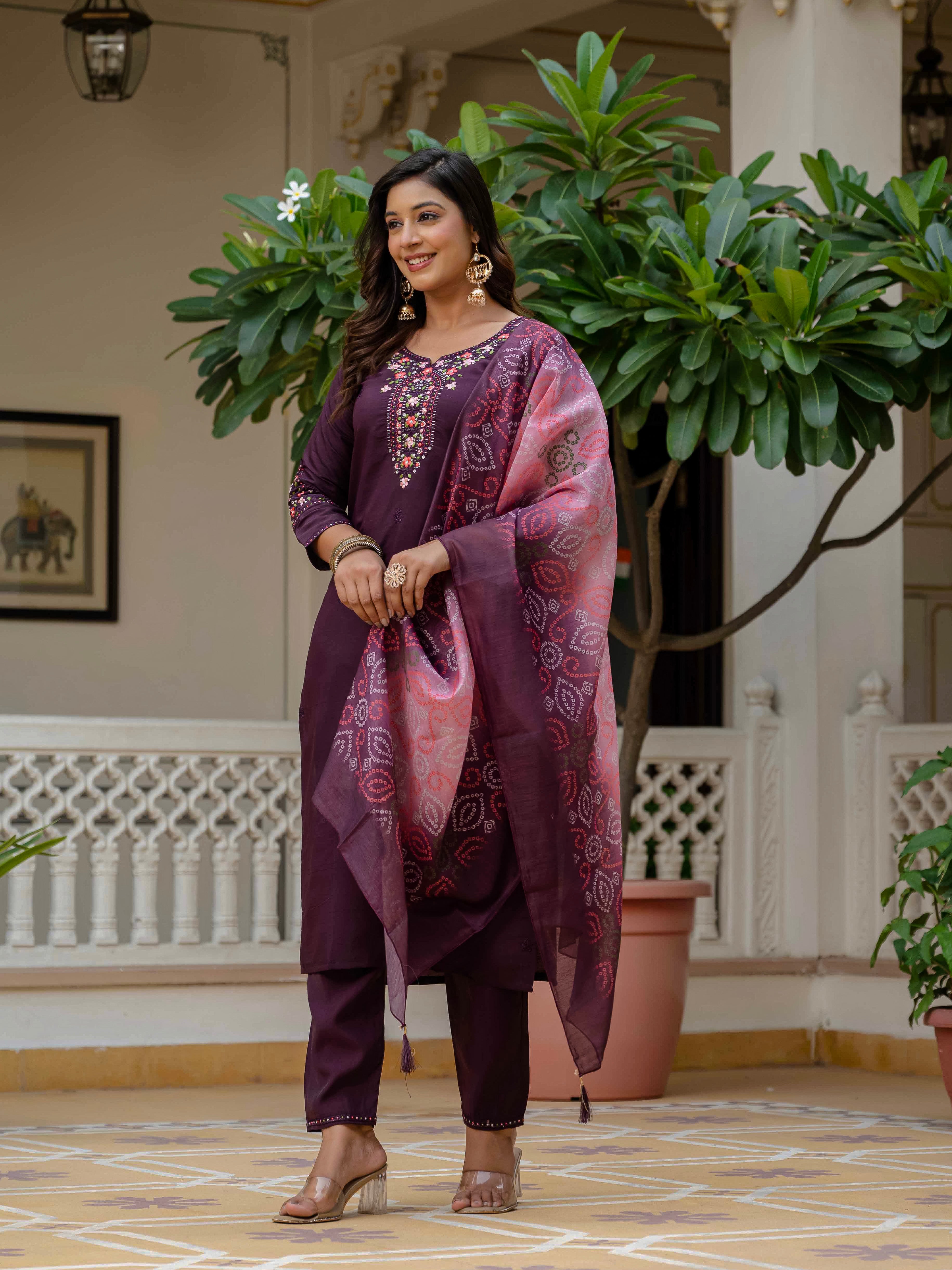 Model elegantly styled in the plum Roman silk ethnic wear, showcasing the complete three-piece ensemble with matching accessories.