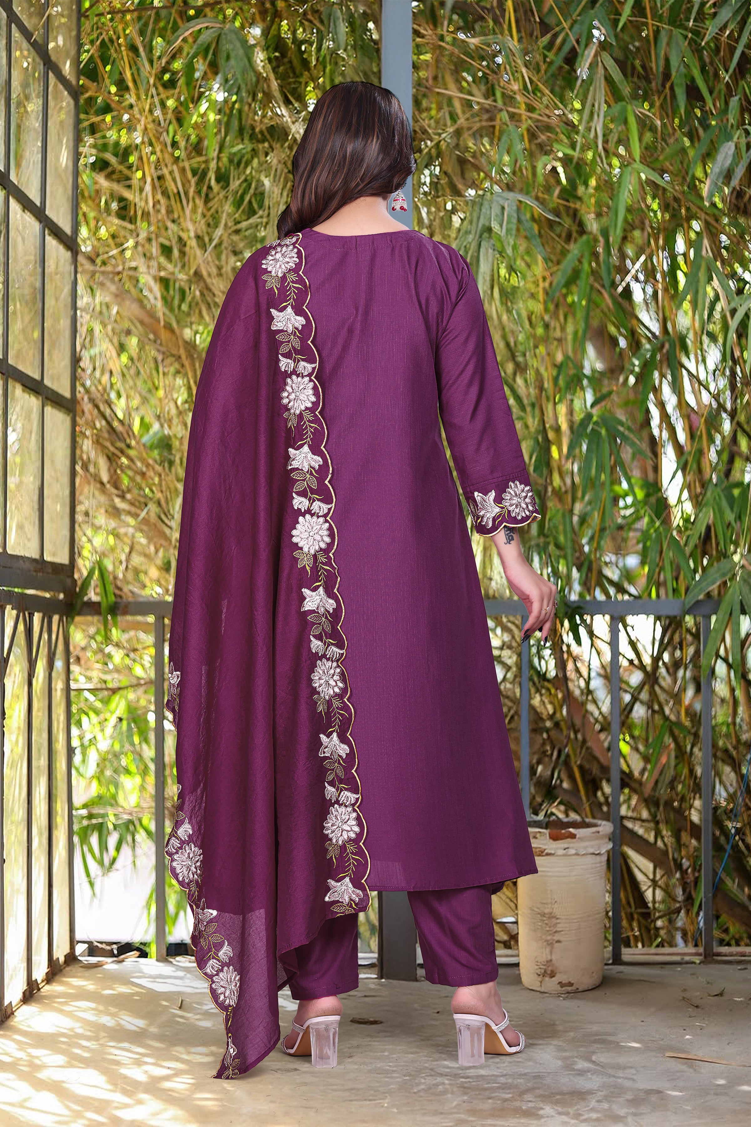 Back view of model in purple rayon slub kurti set, showing the plain back of the kurti and straight pants, with embroidered dupatta.