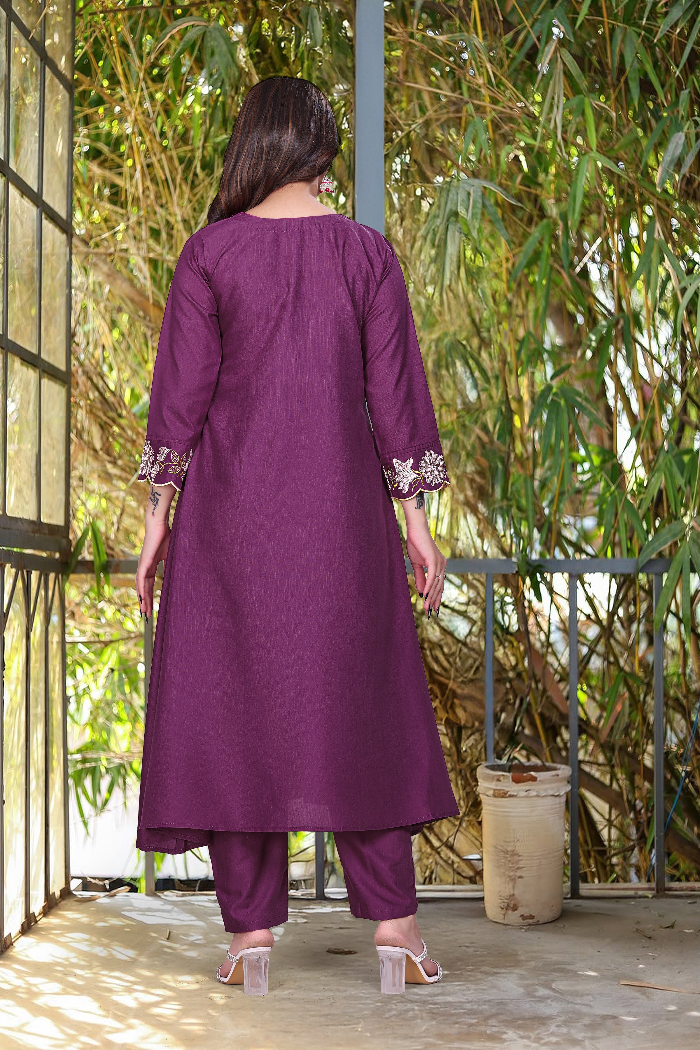 Back view of model in purple rayon slub kurti set, displaying embroidered cuffs on sleeves and the straight back design.