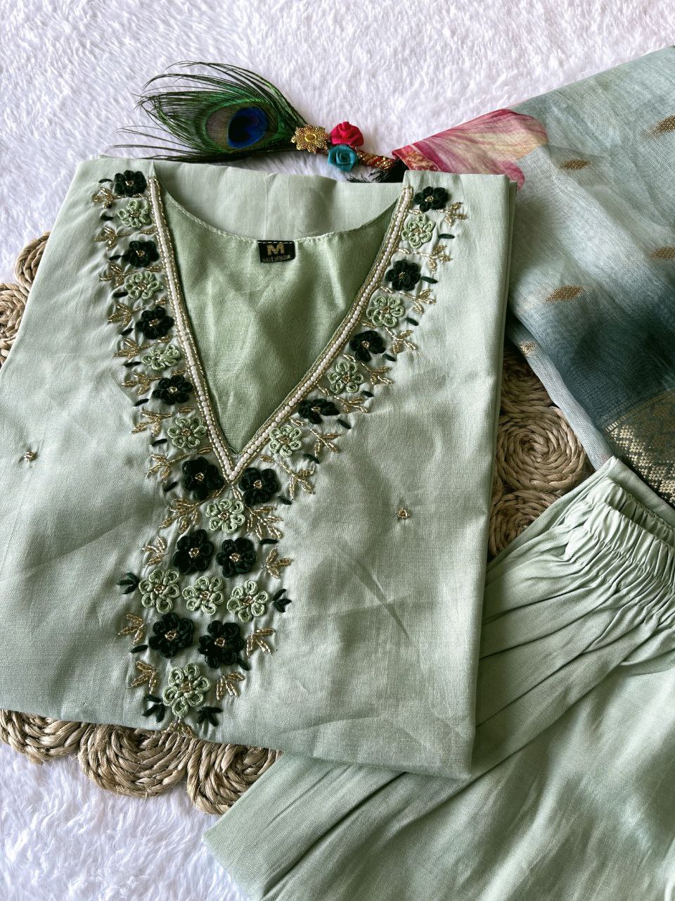 Pistagreen handwork kurti, pant & dupatta set worn by a woman