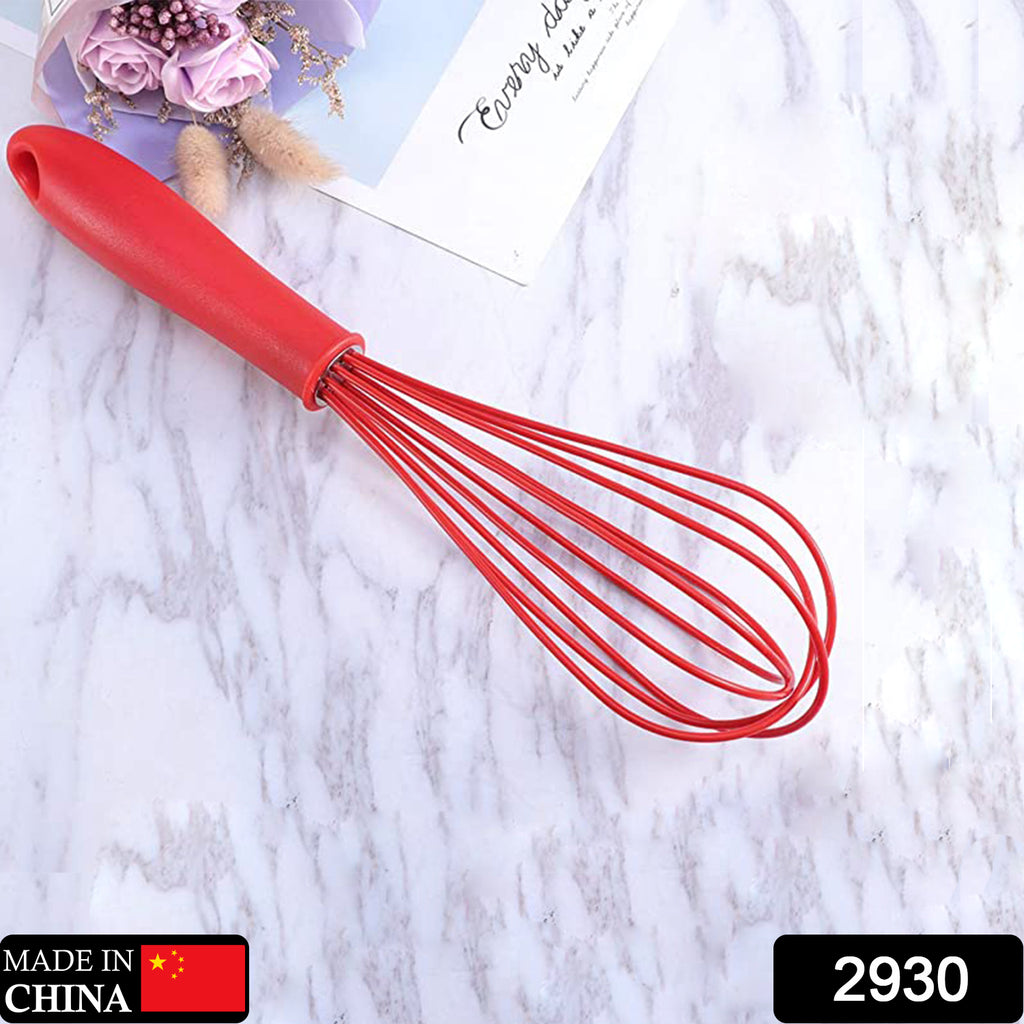 Manual blue silicone rotary egg whisk mixer blending cream for baking.
