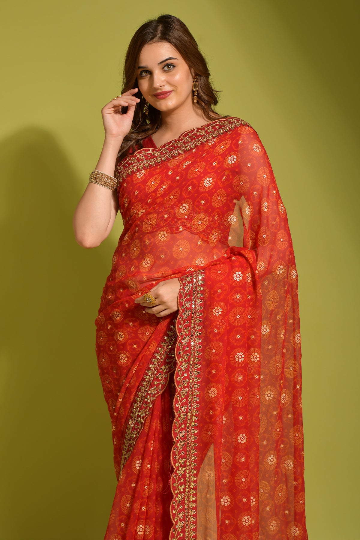 Exquisite red Georgette Chiffon saree featuring flower print, foil & sequin work.