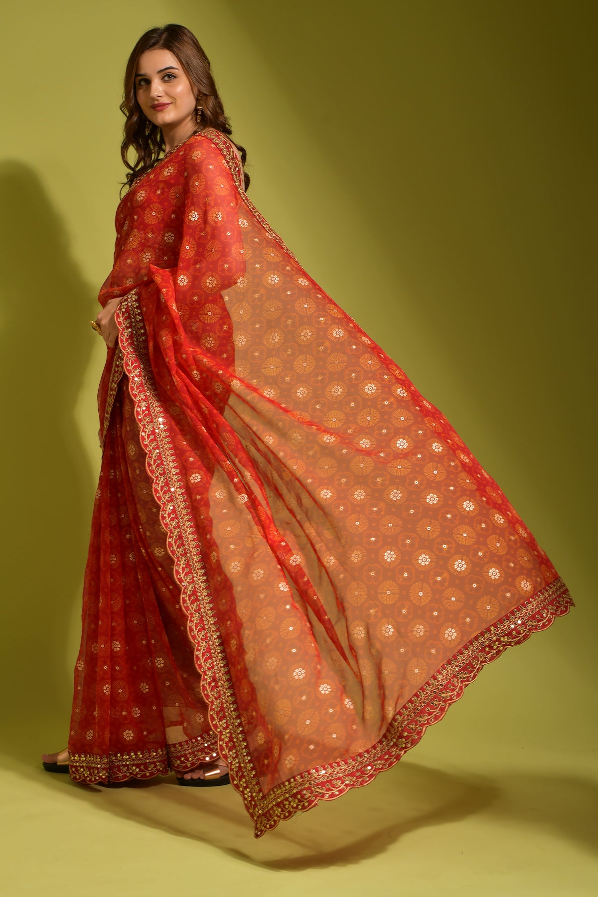 Model wearing exquisite red Georgette Chiffon Saree with floral print, foil & sequin work.