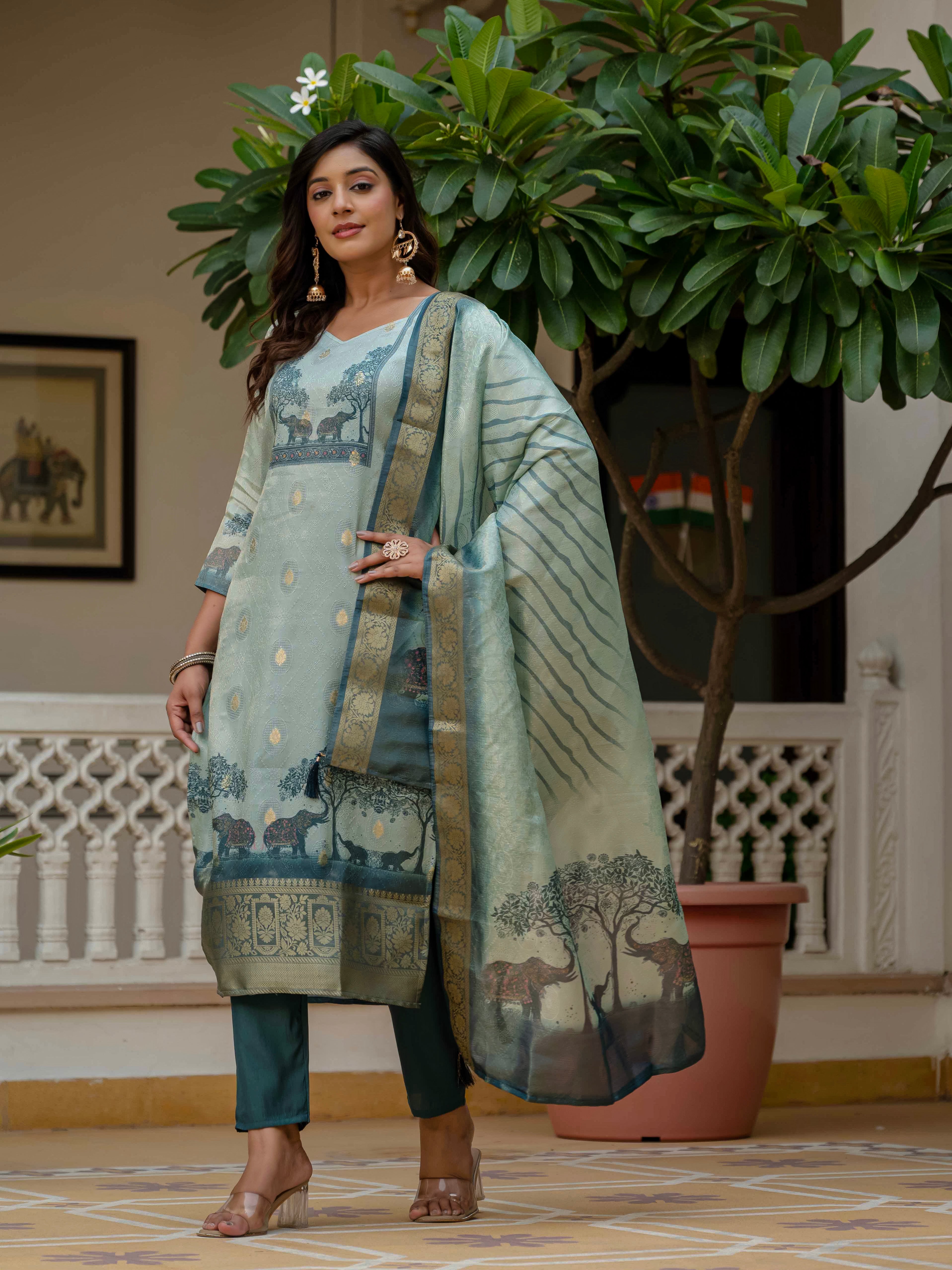 Elegant full shot of a woman in the Royal Blue kurti, pant, and dupatta, hand on hip.