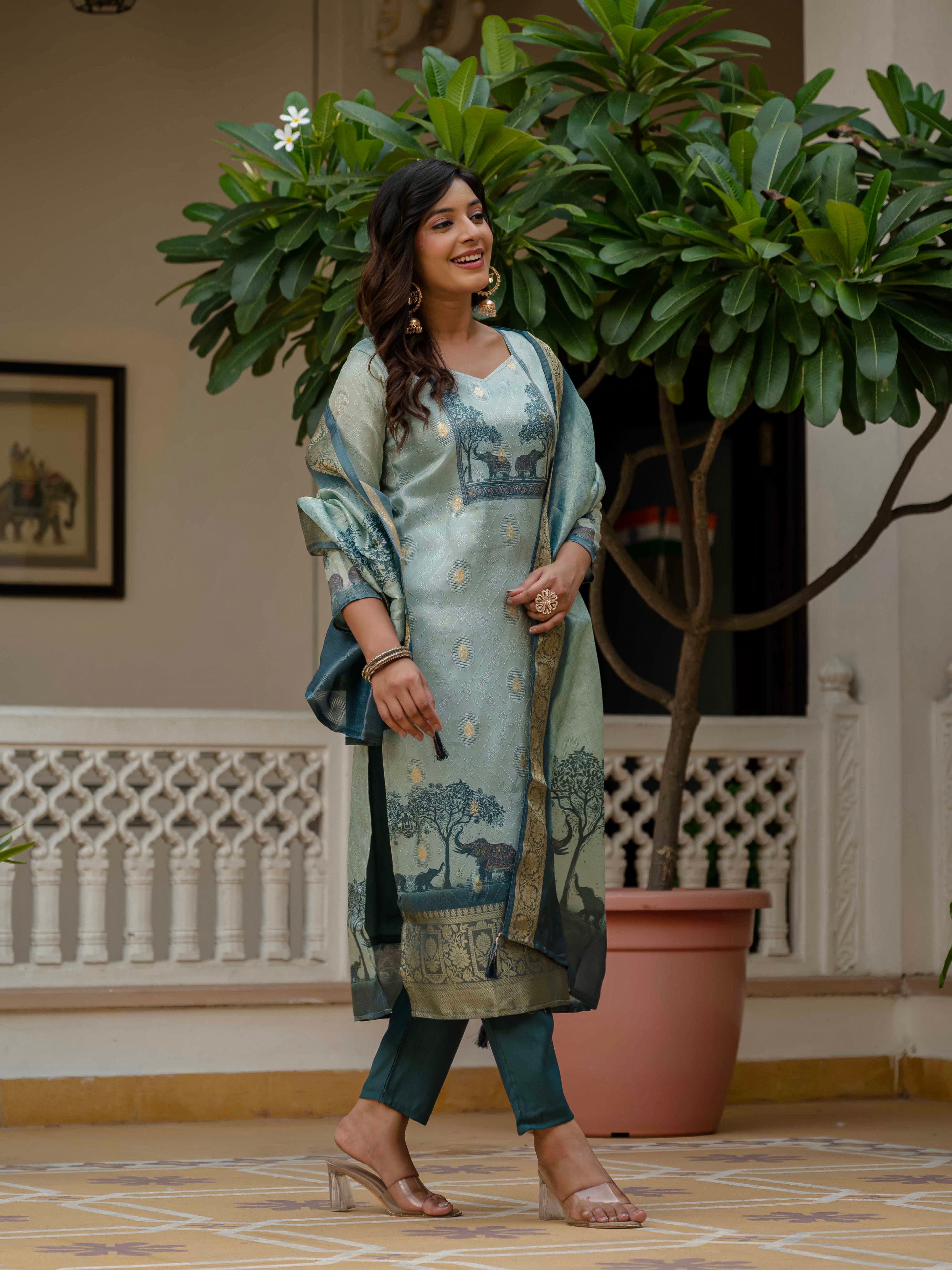 Woman in Royal Blue jacquard silk kurta set walking gracefully, showing the flow of the outfit.