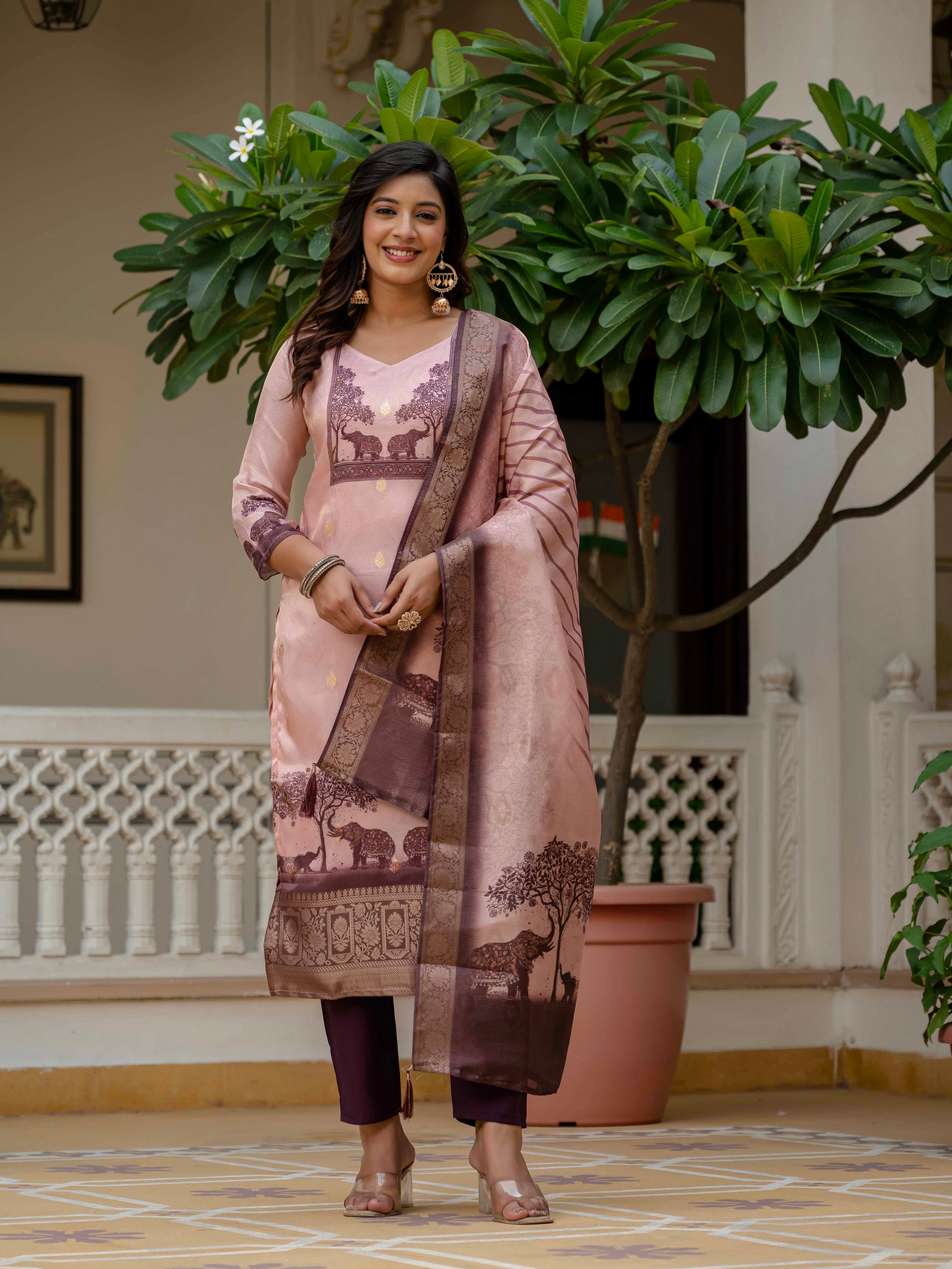 Woman in Royal Pink jacquard silk kurta set with folded hands, presenting the design clearly.