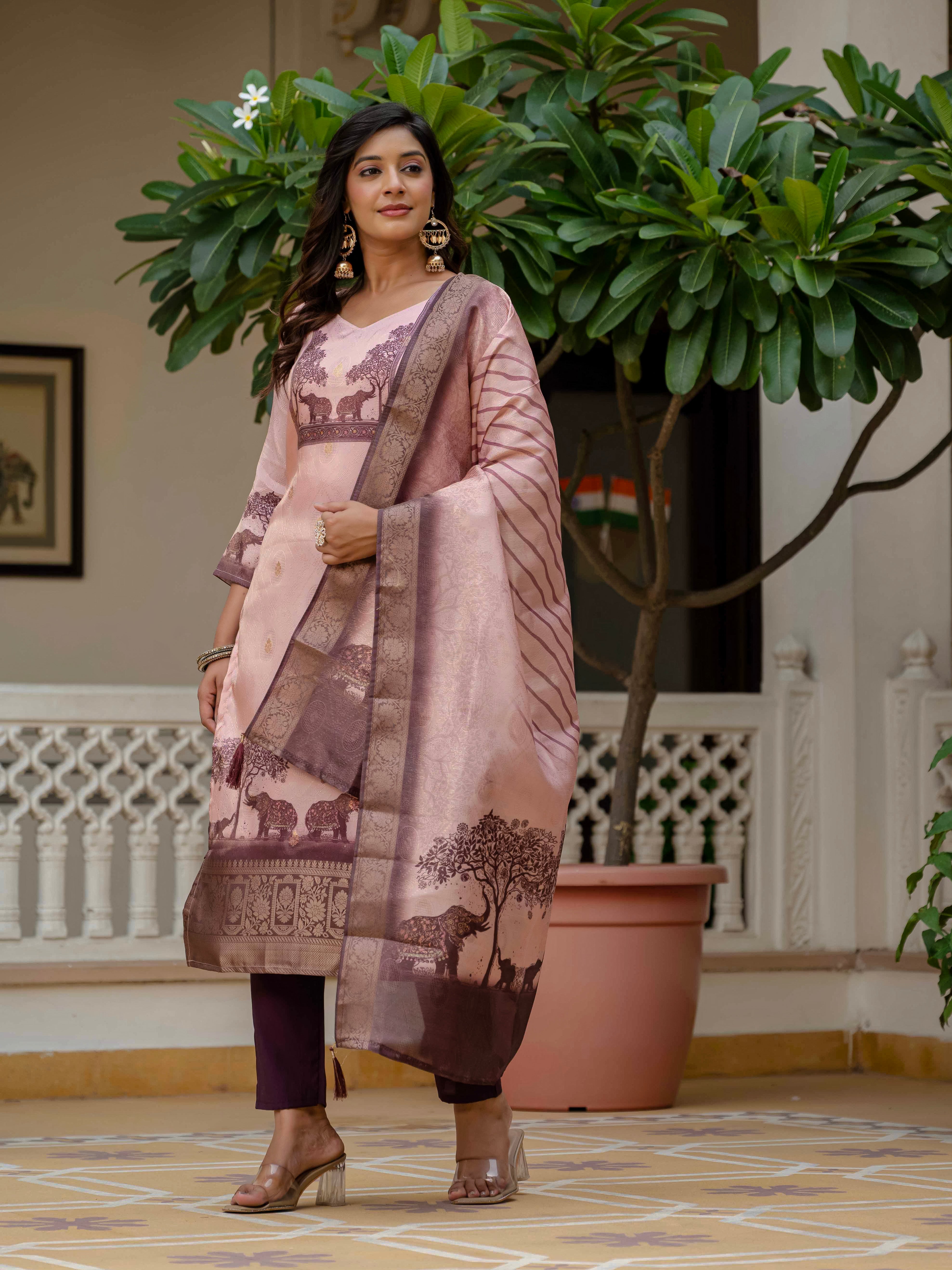 Side profile of a woman in the Royal Pink kurta set, highlighting the drape and border of the dupatta.