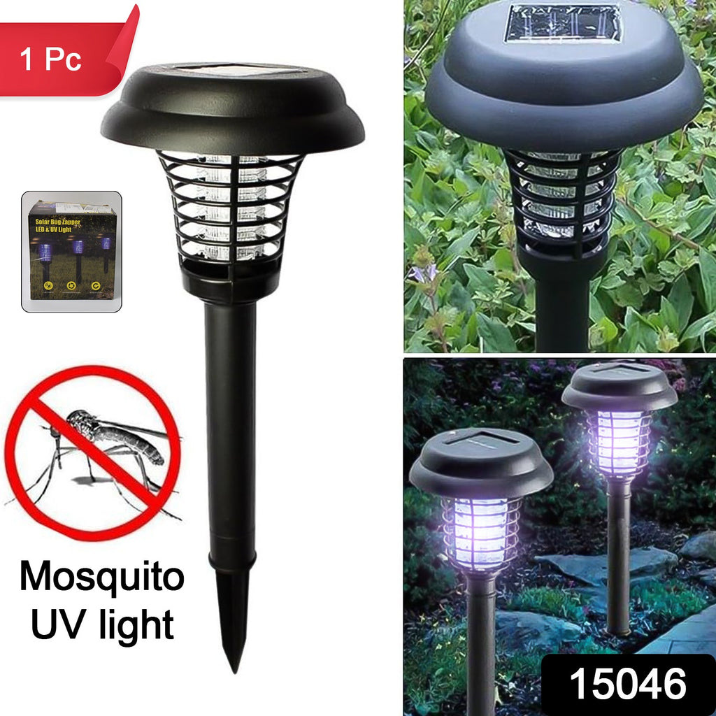 Black solar-powered UV LED bug zapper and mosquito trap with purple light glowing in a dark garden.