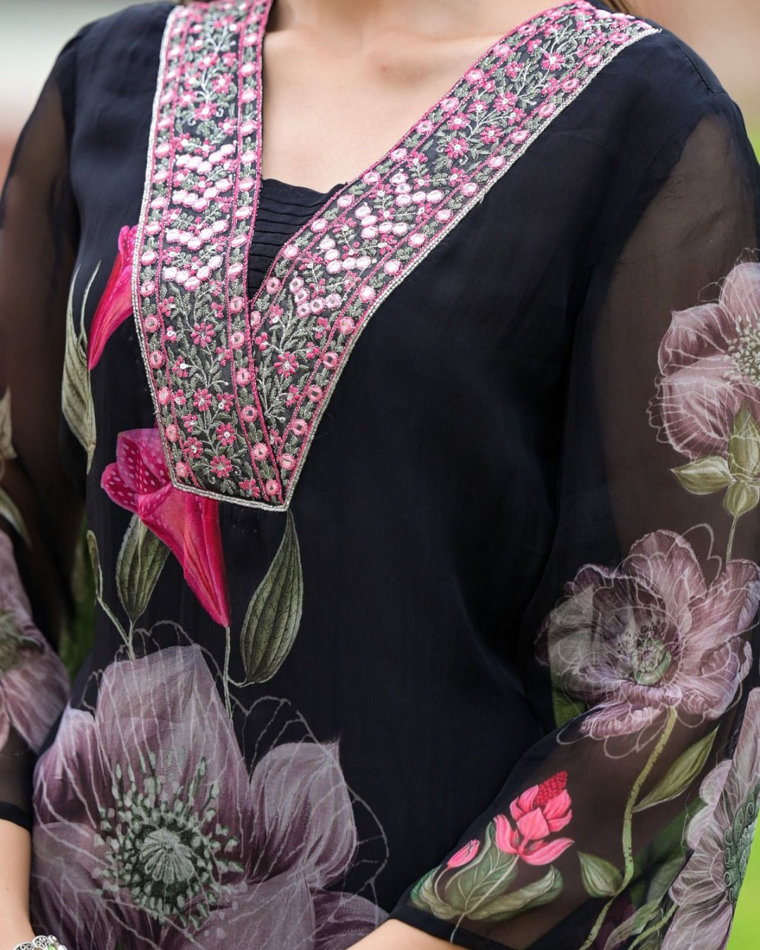 Close-up of the intricate pink and silver embroidery on the V-neck of the TRENDBUY Sonika black kurta.