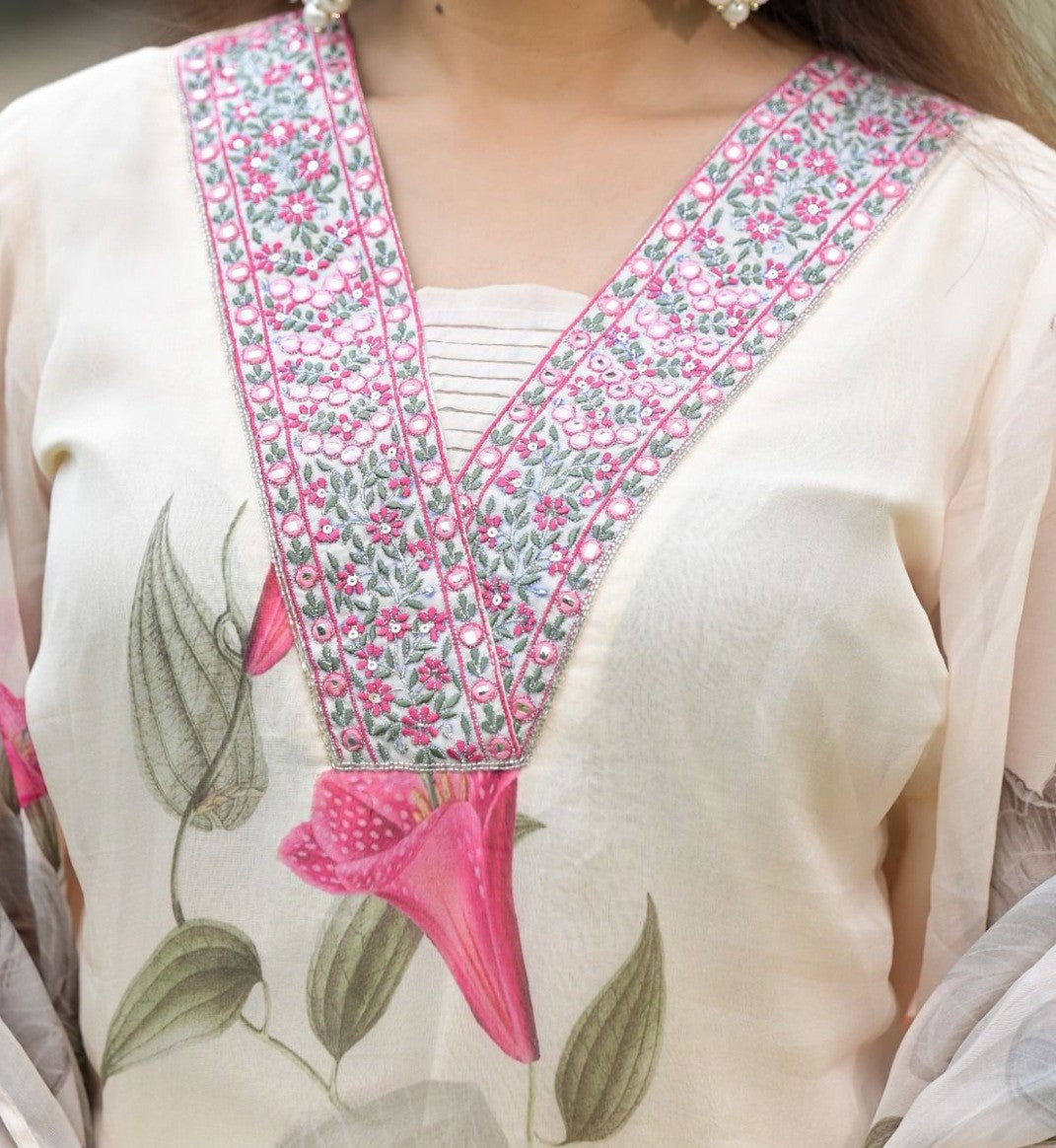 Detailed view of the embroidered V-neckline of the TRENDBUY Sonika white Georgette kurta, pink accents.