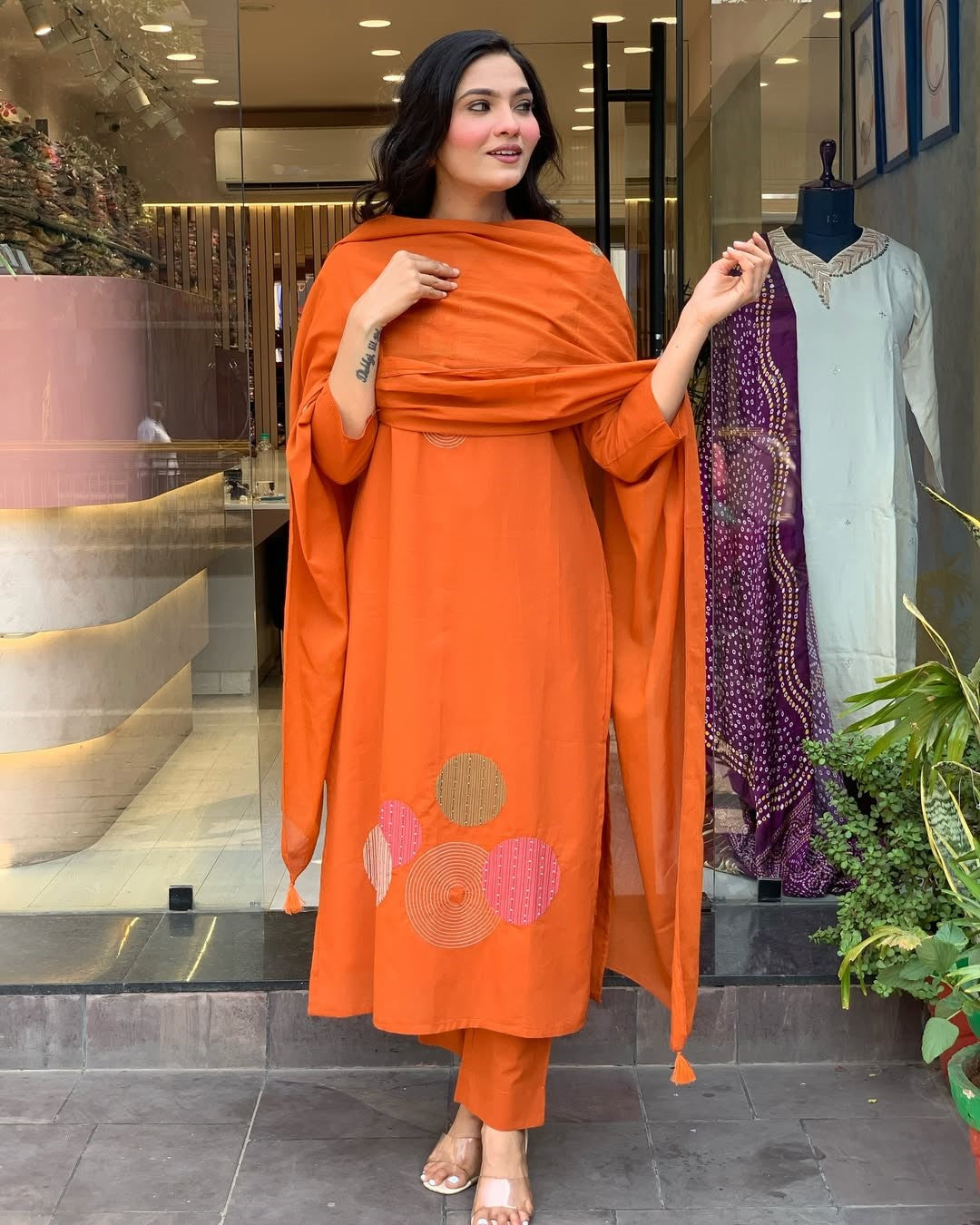 Model posing in TRENDBUY ST-KASHMIRA orange rayon slub kurti set with chanderi dupatta