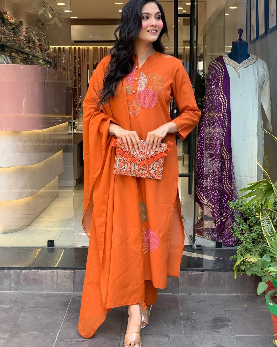 Elegant model showcasing the complete TRENDBUY ST-KASHMIRA orange kurti pant dupatta set