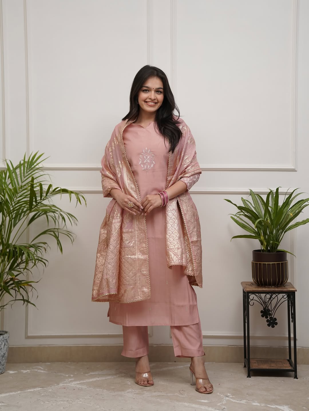 Smiling model wearing TRENDBUY ST-SWATI peach kurti set, posing frontally, emphasizing the comfortable fit and elegant appearance of the attire.