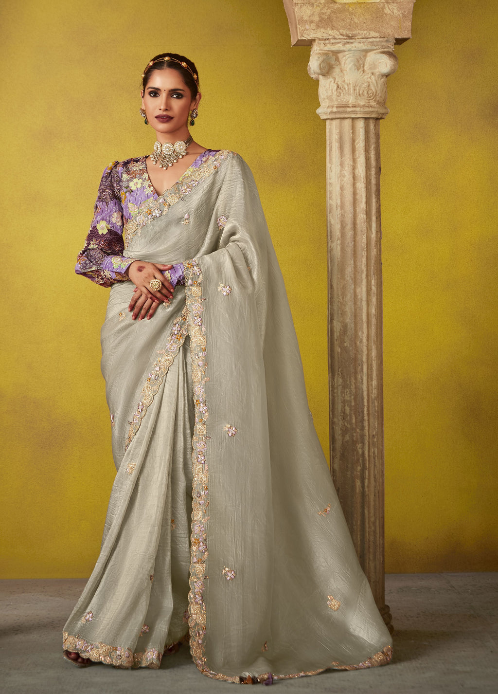 Stylish new design glass tissue saree, elegantly draped, featuring a delicate shimmery fabric.